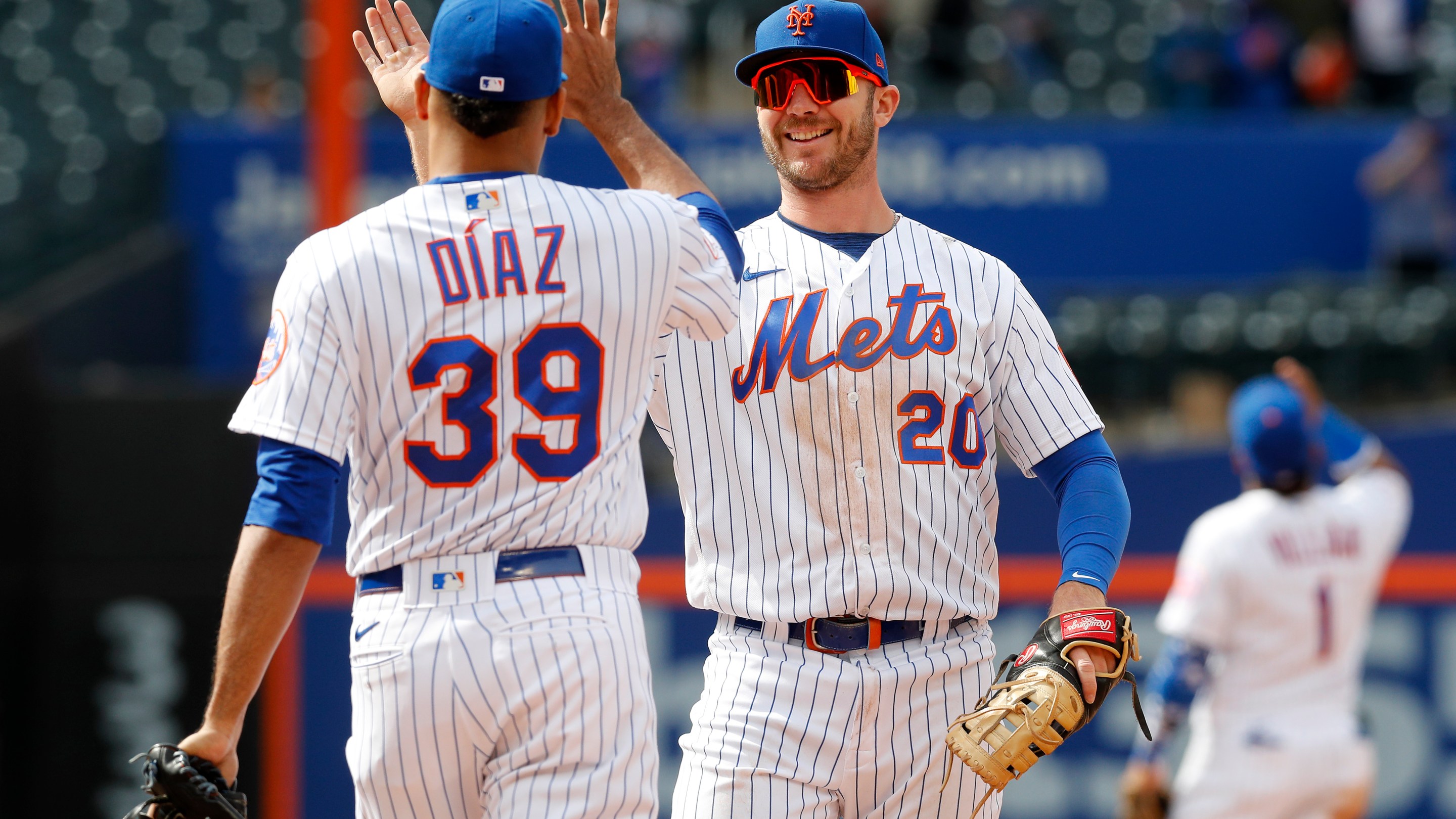Pete Alonso #20 and Edwin Diaz #39 of the New York Mets celebrate after defeating the Washington Nationals