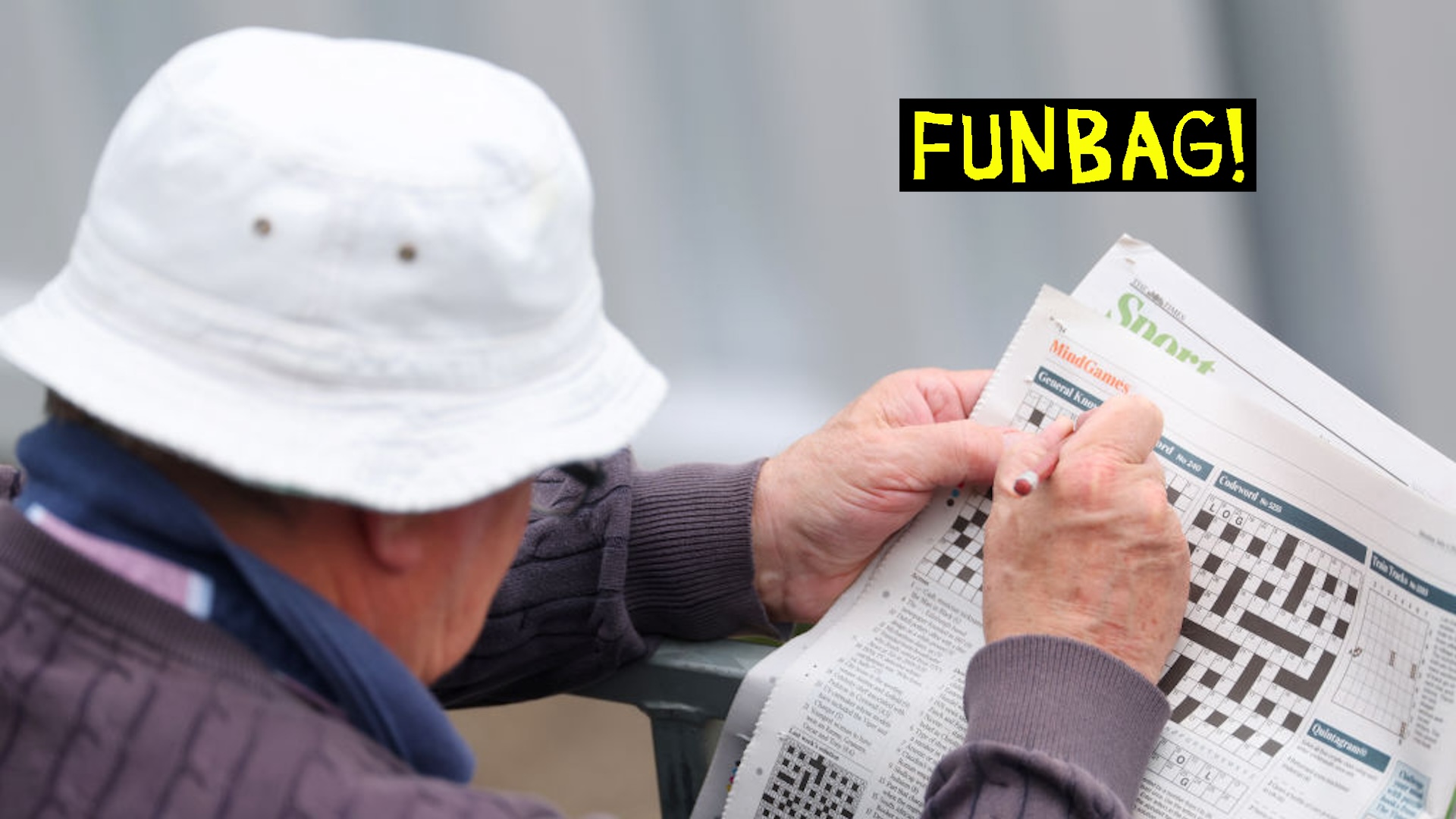A spectator attempts to complete a newspaper crossword during the Vitality County Championship match between Gloucestershire and Glamorgan at College Ground on July 01, 2024 in Cheltenham, England.