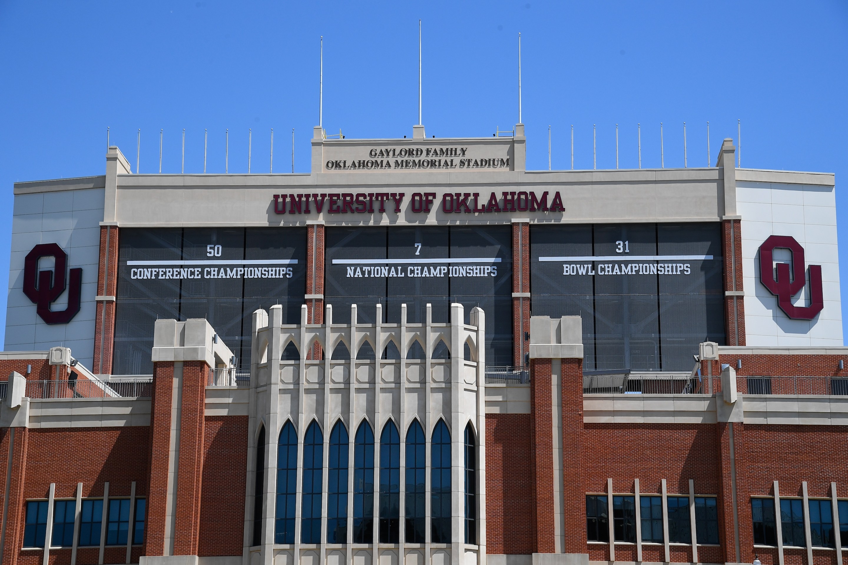 A general view of the OU logo and signage for 50 Conference Championships, 7 National Championships, and 31 Bowl Championships on June 8, 2025, on the facade of the Gaylord Family - Oklahoma Memorial Stadium at the University of Oklahoma in Norman, OK.