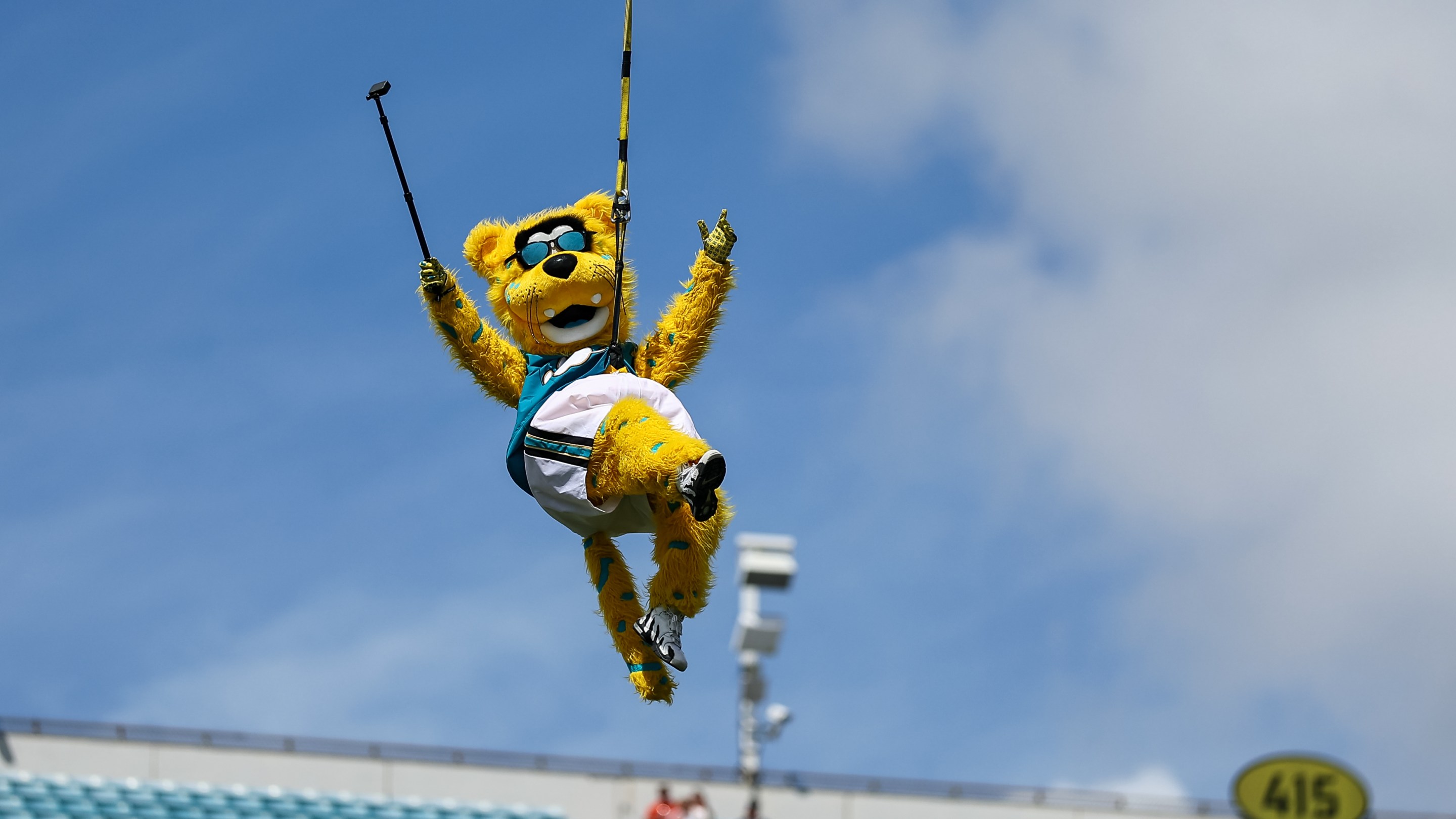 JACKSONVILLE, FLORIDA - SEPTEMBER 21: Mascot Jaxson de Ville of the Jacksonville Jaguars leaps from the light towers prior to the game against the Houston Texans at EverBank Field on September 21, 2025 in Jacksonville, Florida. (Photo by Mike Carlson/Getty Images)