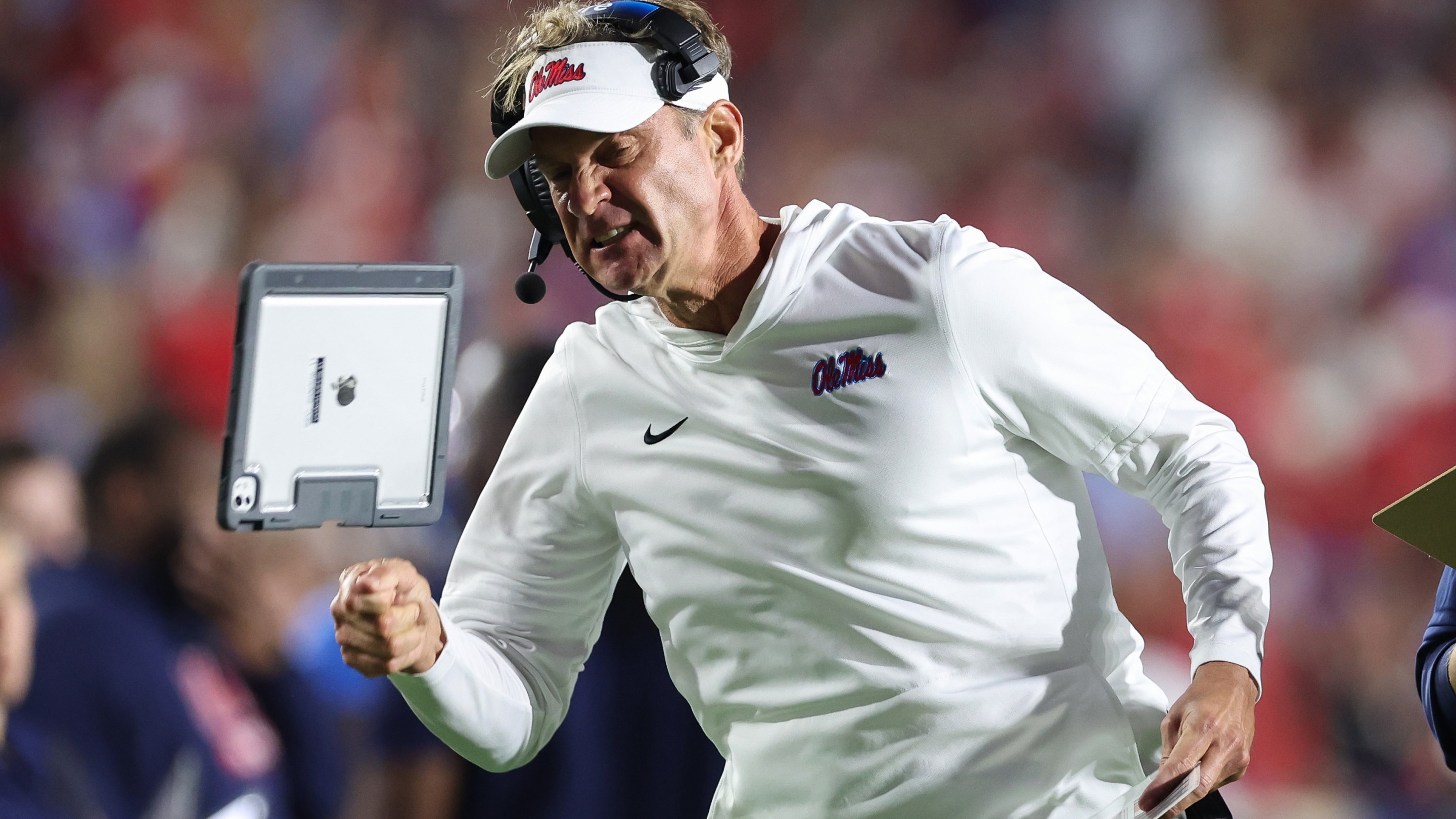 Lane Kiffin of the Mississippi Rebels reacts after a penalty against the Florida Gators at Vaught-Hemingway Stadium on November 15, 2025 in Oxford, Mississippi. He's yelling and throwing his ipad like a little kid.
