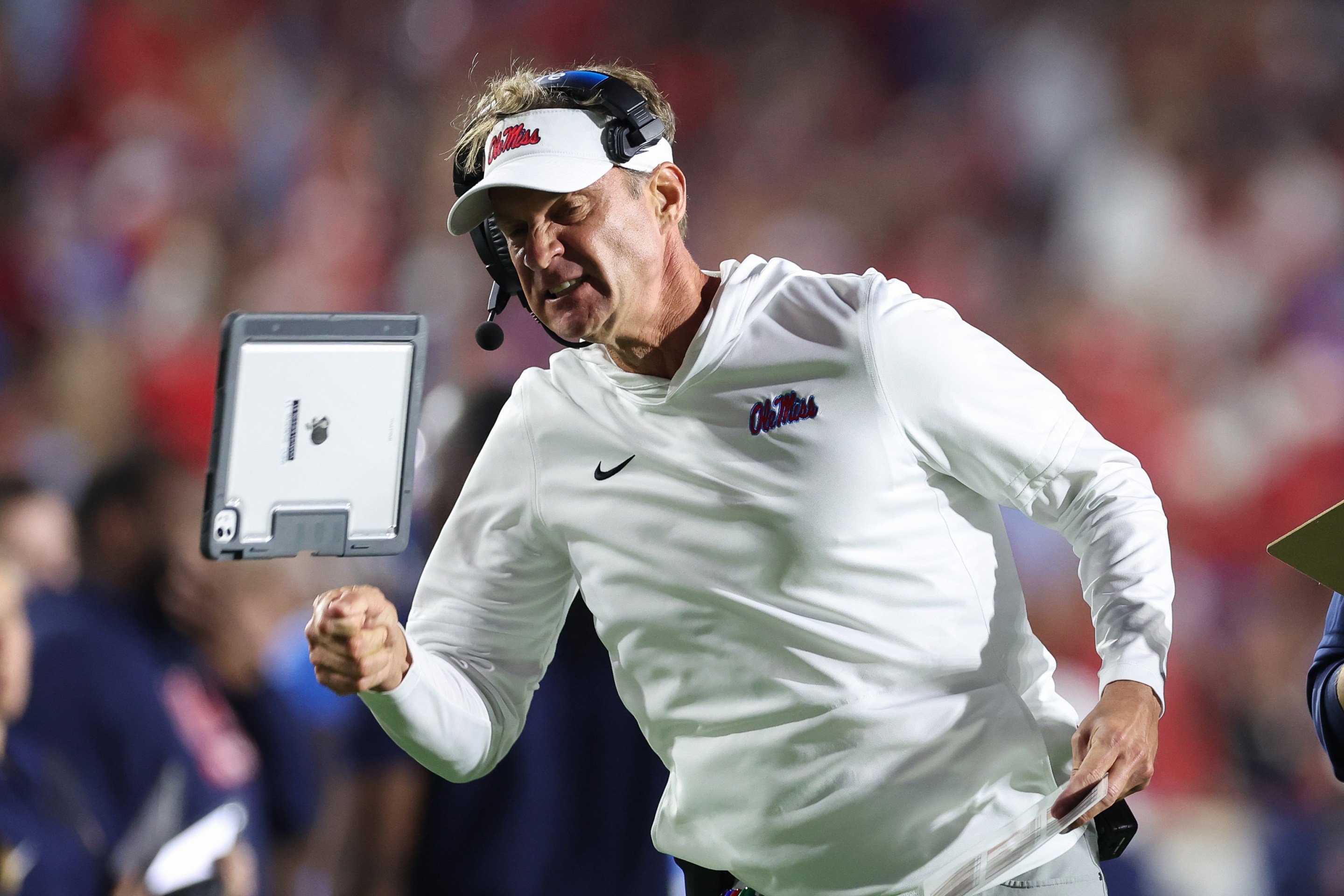 Lane Kiffin of the Mississippi Rebels reacts after a penalty against the Florida Gators at Vaught-Hemingway Stadium on November 15, 2025 in Oxford, Mississippi. He's yelling and throwing his ipad like a little kid.