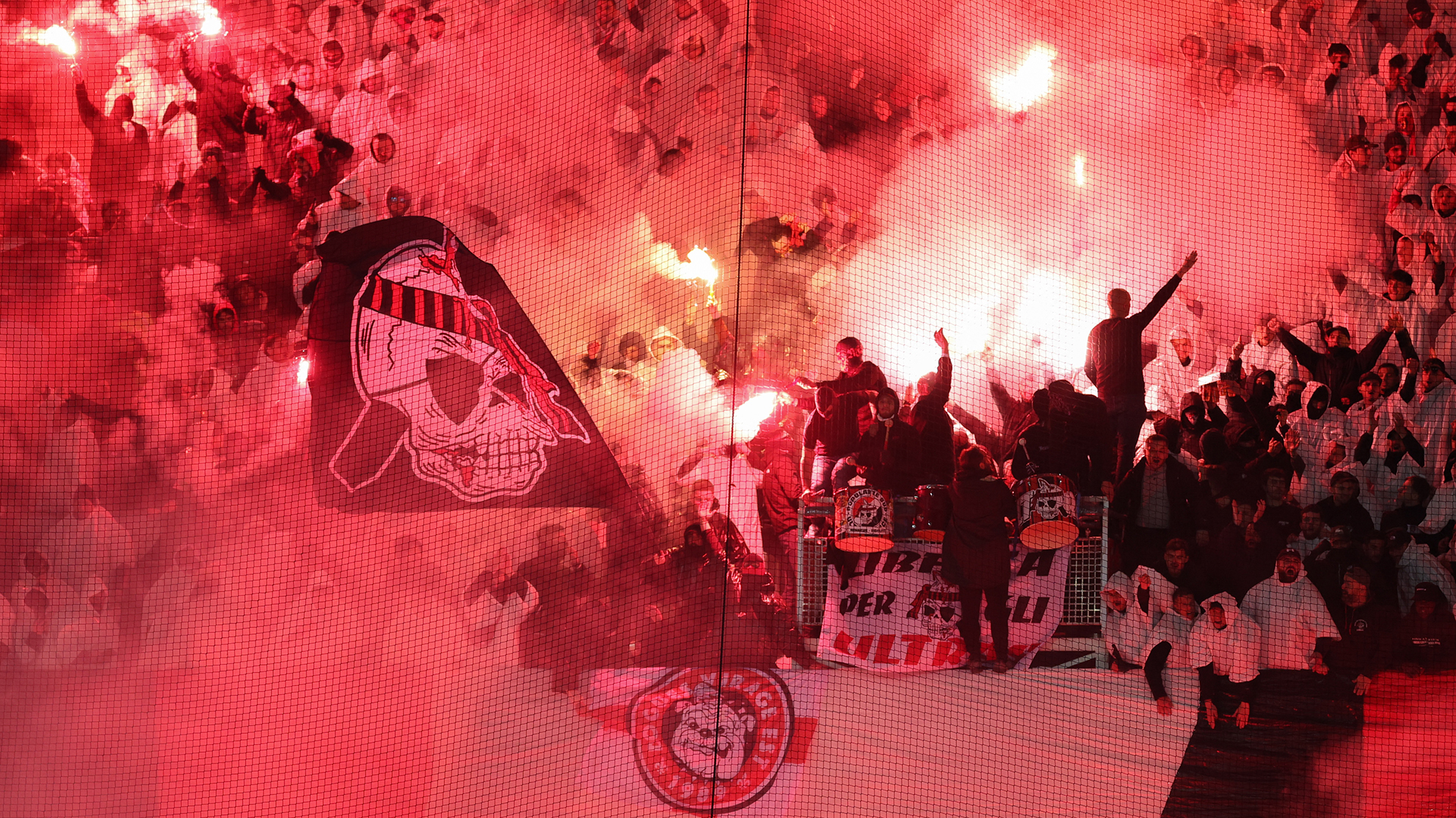 Nice's fans cheer their team with smoke flares during the French L1 football match between OGC Nice and Olympique de Marseille (OM) at the Allianz Riviera stadium in Nice, south-eastern France, on November 21, 2025.