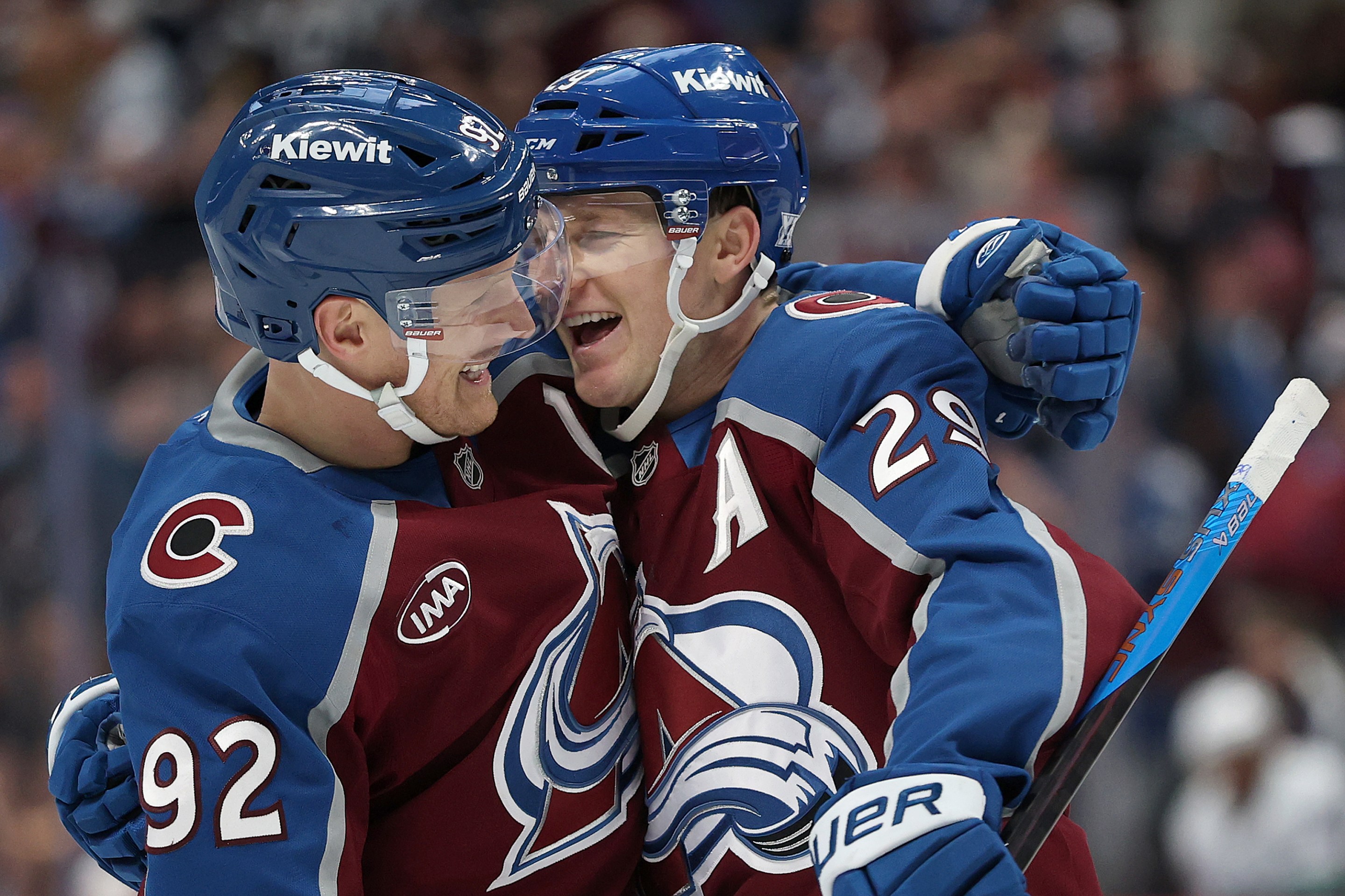 Nathan MacKinnon #29 of the Colorado Avalanche celebrates with Gabriel Landeskog