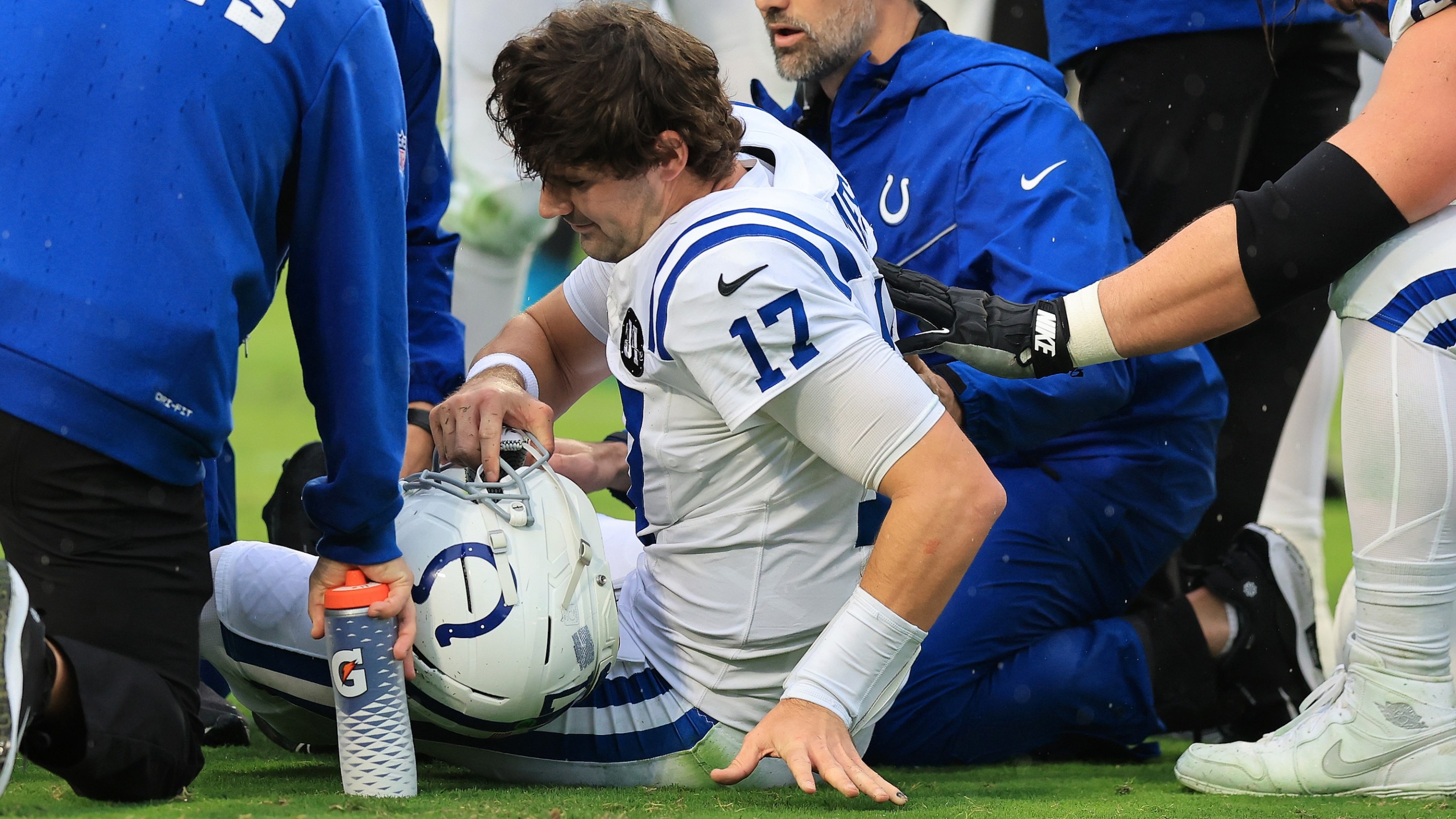 JACKSONVILLE, FLORIDA - DECEMBER 07: Daniel Jones #17 of the Indianapolis Colts is checked on by trainers after an injury during the first quarter against the Jacksonville Jaguars at EverBank Stadium on December 07, 2025 in Jacksonville, Florida. (Photo by Mike Carlson/Getty Images)