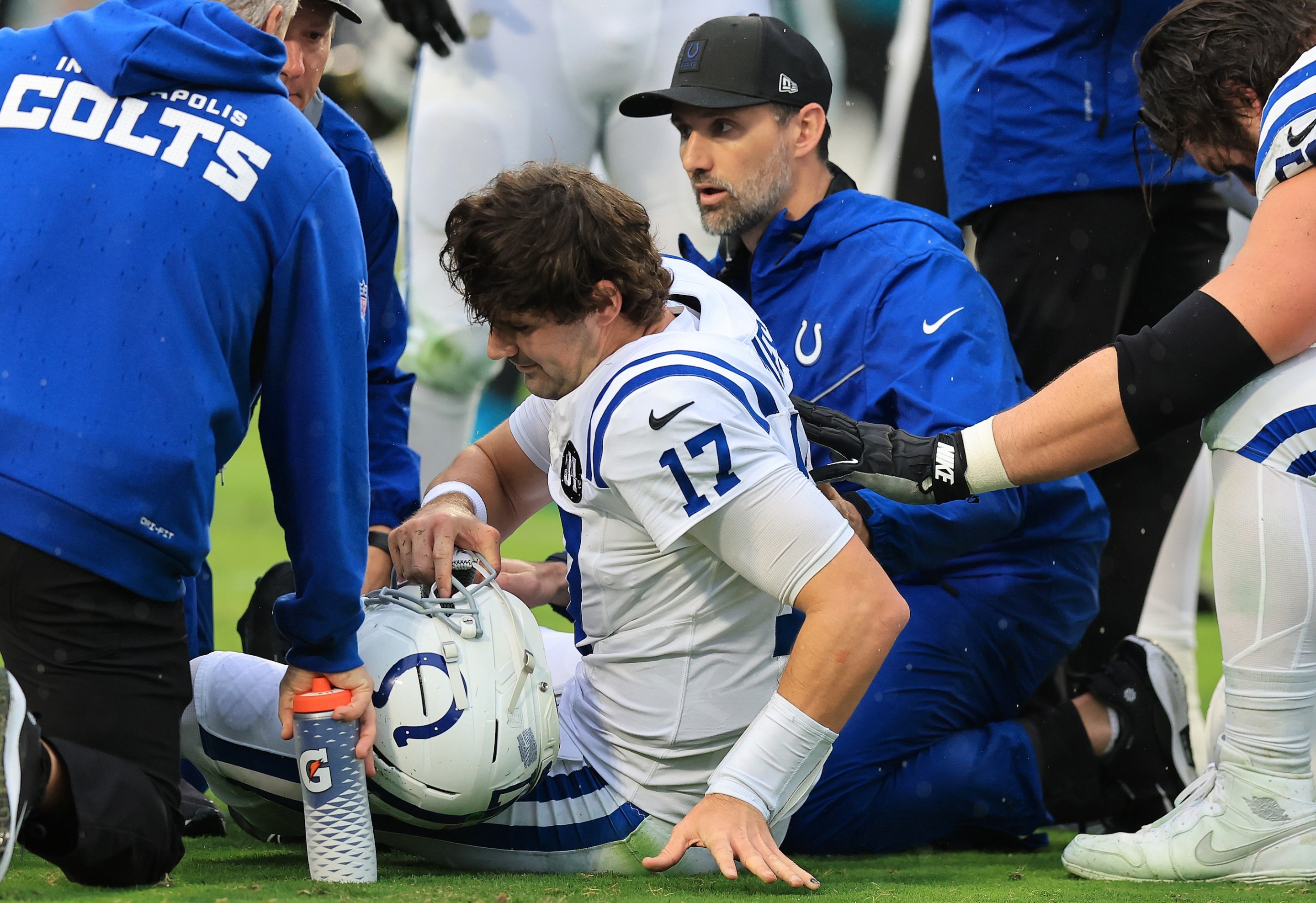 JACKSONVILLE, FLORIDA - DECEMBER 07: Daniel Jones #17 of the Indianapolis Colts is checked on by trainers after an injury during the first quarter against the Jacksonville Jaguars at EverBank Stadium on December 07, 2025 in Jacksonville, Florida. (Photo by Mike Carlson/Getty Images)