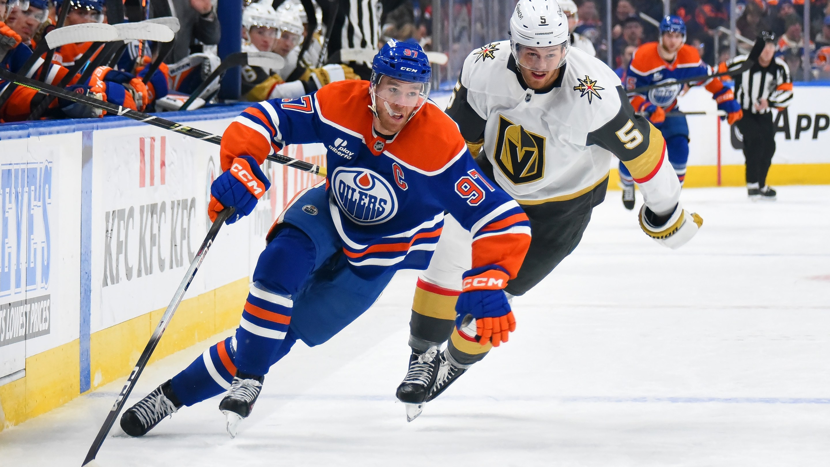 EDMONTON, CANADA - DECEMBER 21: Connor McDavid #97 of the Edmonton Oilers shields the puck from Jeremy Lauzon #5 of the Vegas Golden Knights during the second period of the game at Rogers Place on December 21, 2025, in Edmonton, Alberta, Canada. (Photo by Leila Devlin/Getty Images)