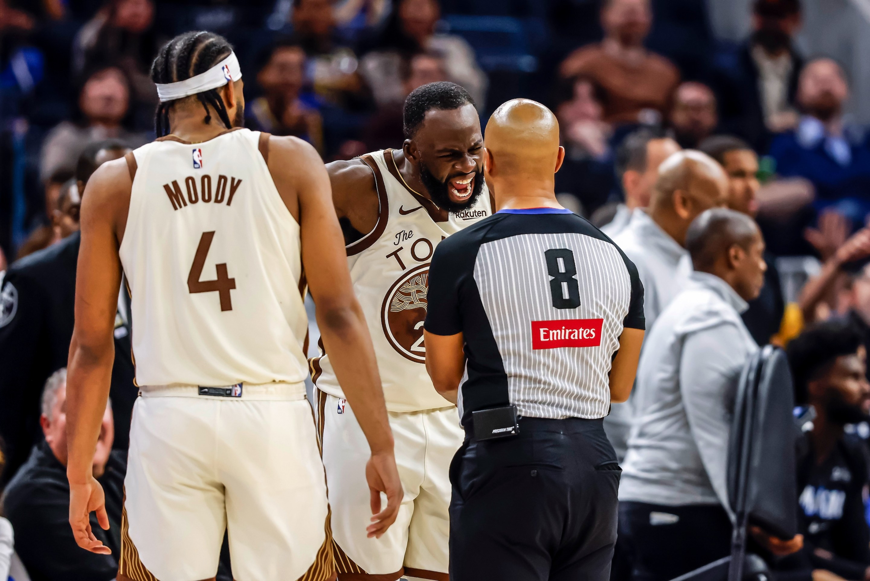 Draymond Green (23) argues an out of bounds call with referee Marc Davis (8) in the first half as the Golden State Warriors played the Orlando Magic on December 22, 2025.