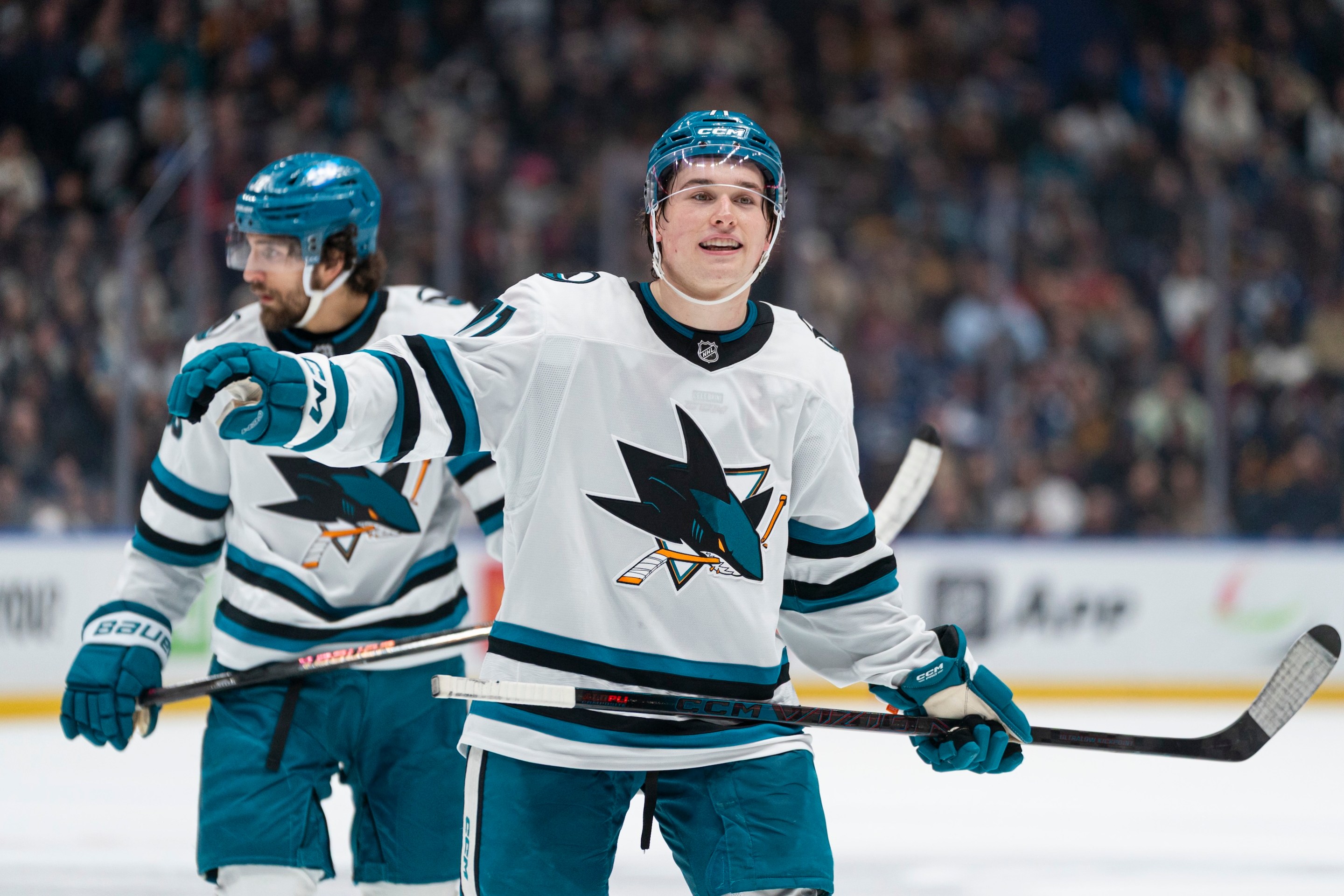 VANCOUVER, CANADA - DECEMBER 27: Macklin Celebrini #71 of the San Jose Sharks gestures to a teammate prior to a face-off during NHL action against the Vancouver Canucks at Rogers Arena on December 27, 2025 in Vancouver, Canada. (Photo by Rich Lam/Getty Images)