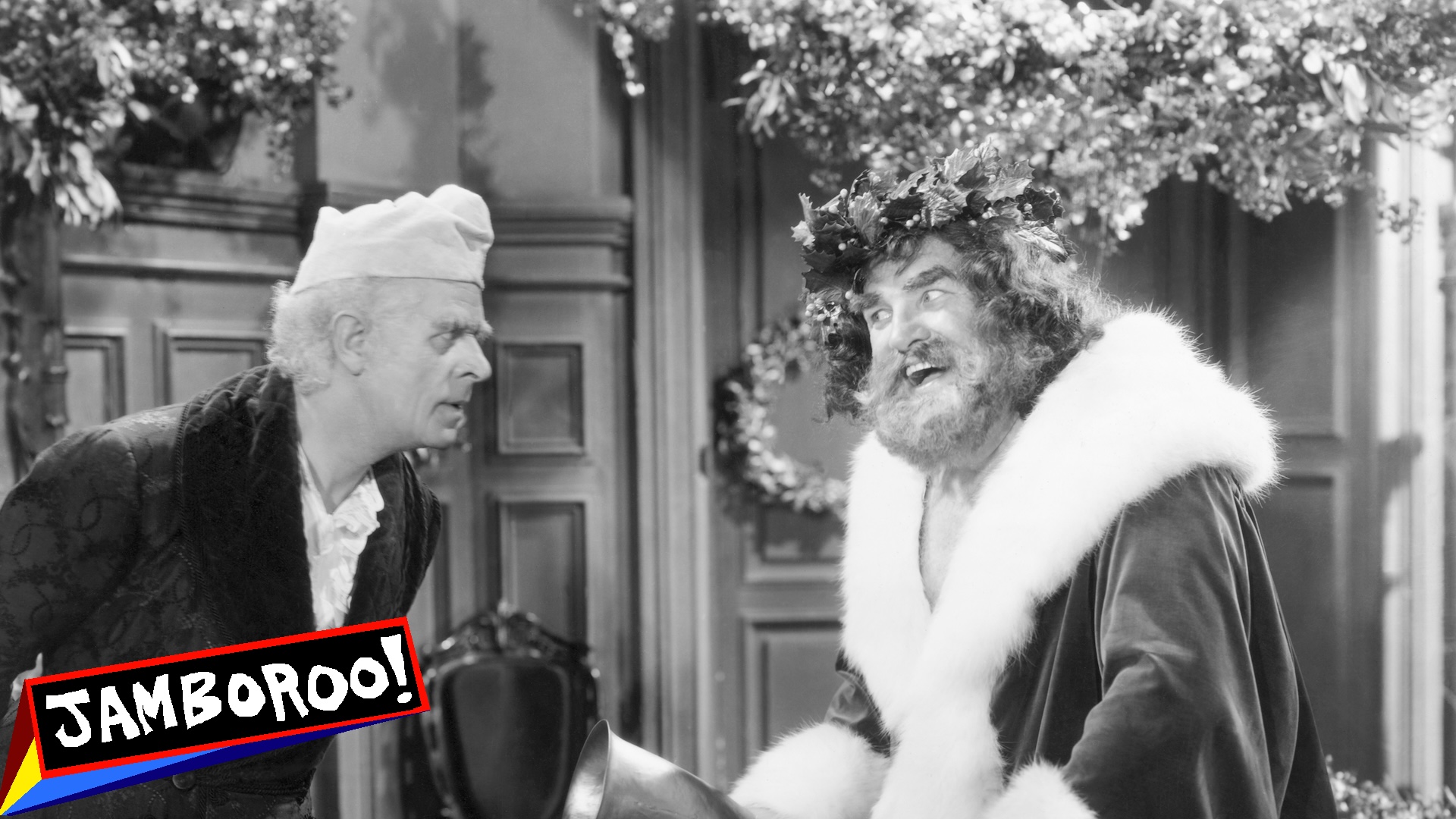 Reginald Owen, playing Scrooge, confronts the Ghost of Christmas Present, played by Lionel Braham, in the 1938 MGM production of "A Christmas Carol." Undated movie still.