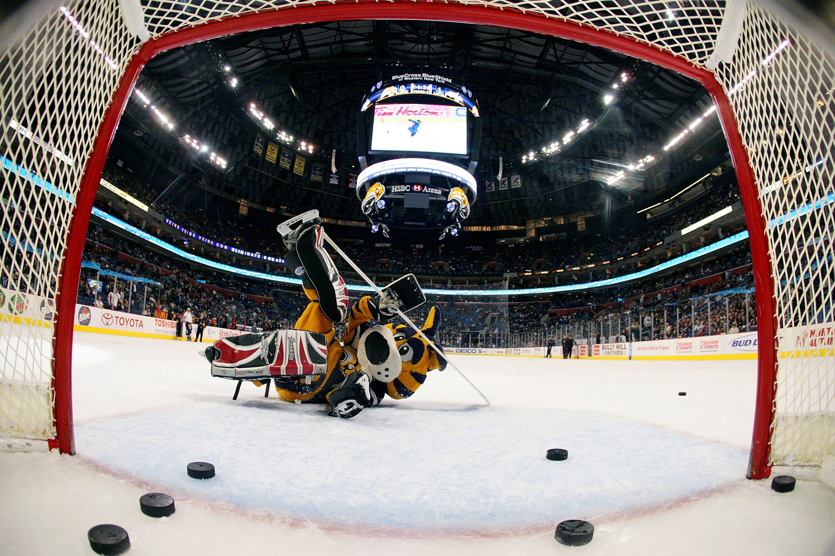 Sabretooth, the mascot of the Buffalo Sabres falls to the ice after allowing plenty of intermission goals to youth hockey players on March 5, 2008 at HSBC Arena in Buffalo, New York.