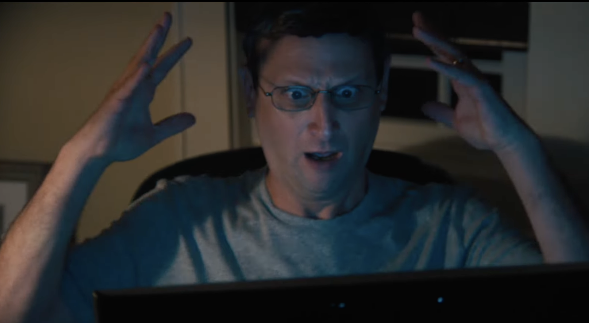 tim robinson using the computer in the chair company