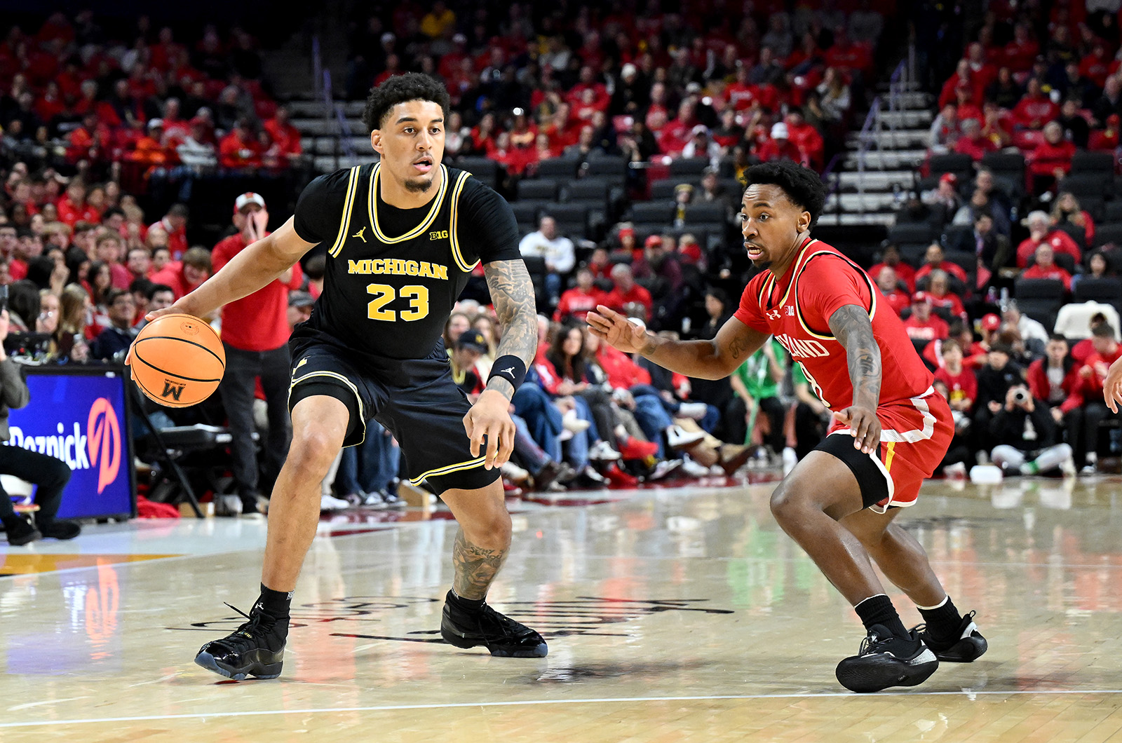 COLLEGE PARK, MARYLAND - DECEMBER 13: Yaxel Lendeborg #23 of the Michigan Wolverines handles the ball in the second half against David Coit #8 of the Maryland Terrapins at Xfinity Center on December 13, 2025 in College Park, Maryland.