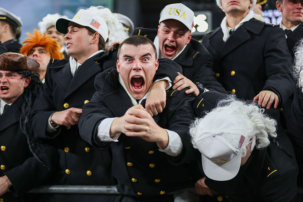 BALTIMORE, MARYLAND - DECEMBER 13: Navy Midshipmen celebrate during a game between the Navy Midshipmen and Army West Point Black Knights at M&amp;T Bank Stadium on December 13, 2025 in Baltimore, Maryland.