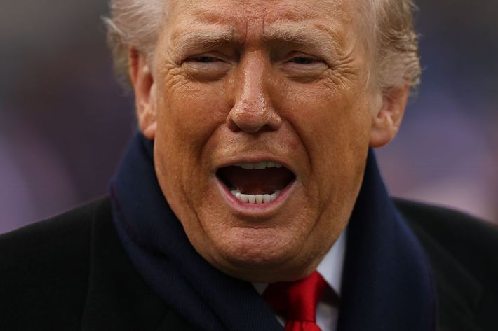BALTIMORE, MARYLAND - DECEMBER 13: U.S. President Donald Trump looks on from the field before the 126th America's Game between the Army Black Knights and the Navy Midshipmen at M&T Bank Stadium on December 13, 2025 in Baltimore, Maryland. The teams are competing for the Commander-in-Chief's Trophy, with President Trump attending the rivalry for the second consecutive year.