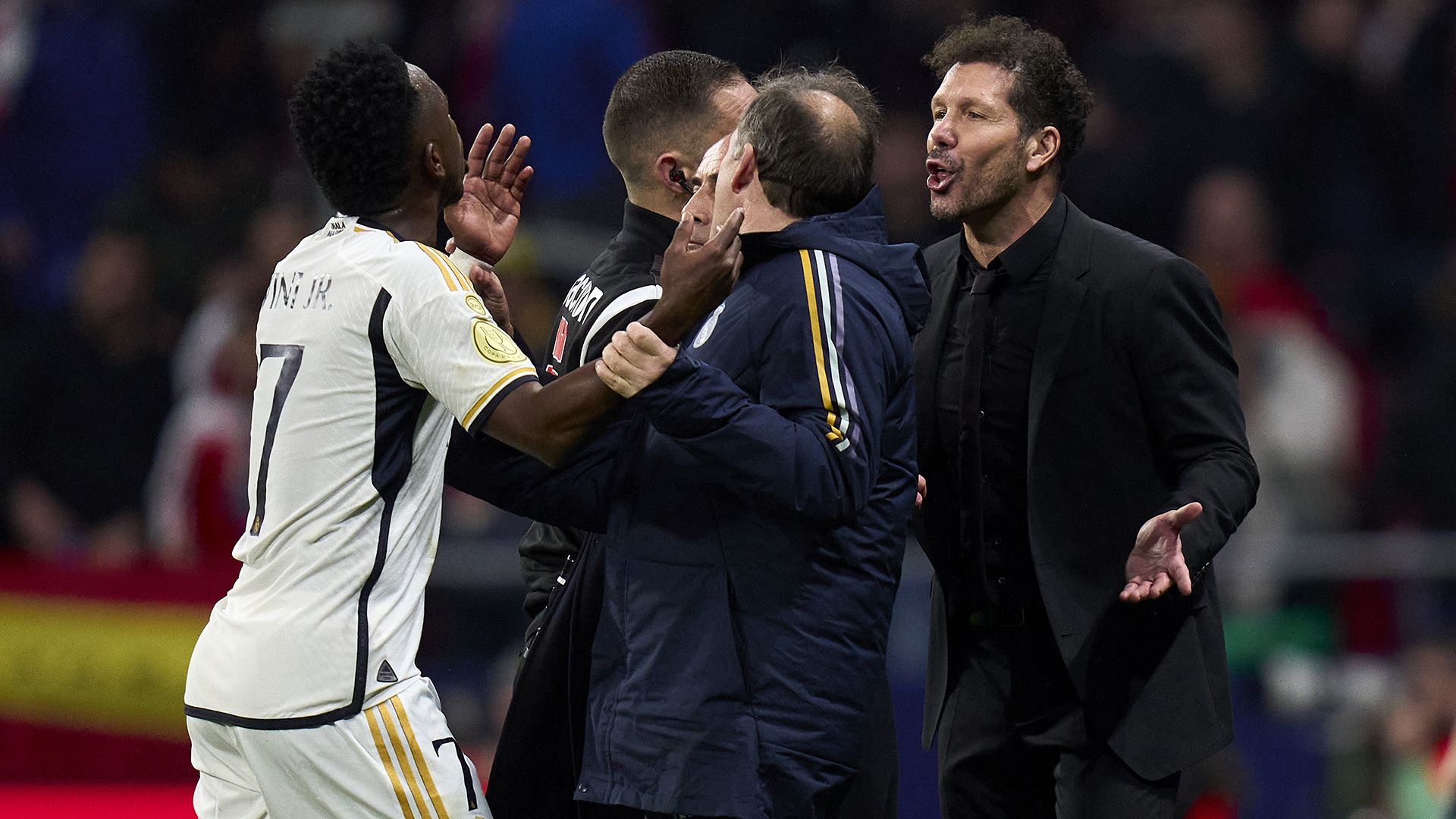 Diego Simeone head coach of Atletico de Madrid argues with Vinicius Junior of Real Madrid CF during Copa del Rey match between Atletico Madrid and Real Madrid CF at Civitas Metropolitano Stadium on January 18, 2024 in Madrid, Spain.