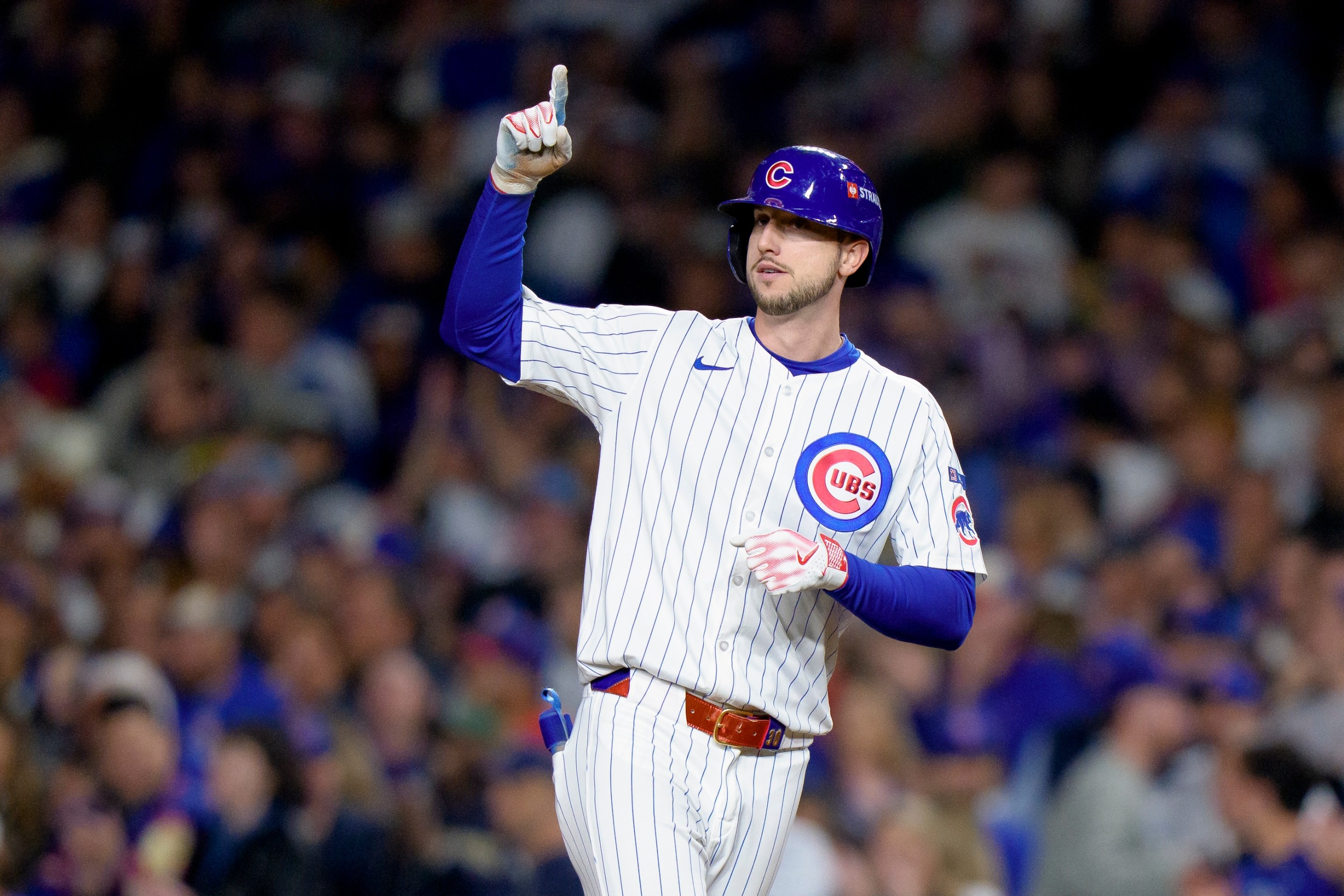 Kyle Tucker of the Chicago Cubs celebrates a hit in Game Four of the National League Division Series against the Milwaukee Brewers at Wrigley Field on October 9, 2025.