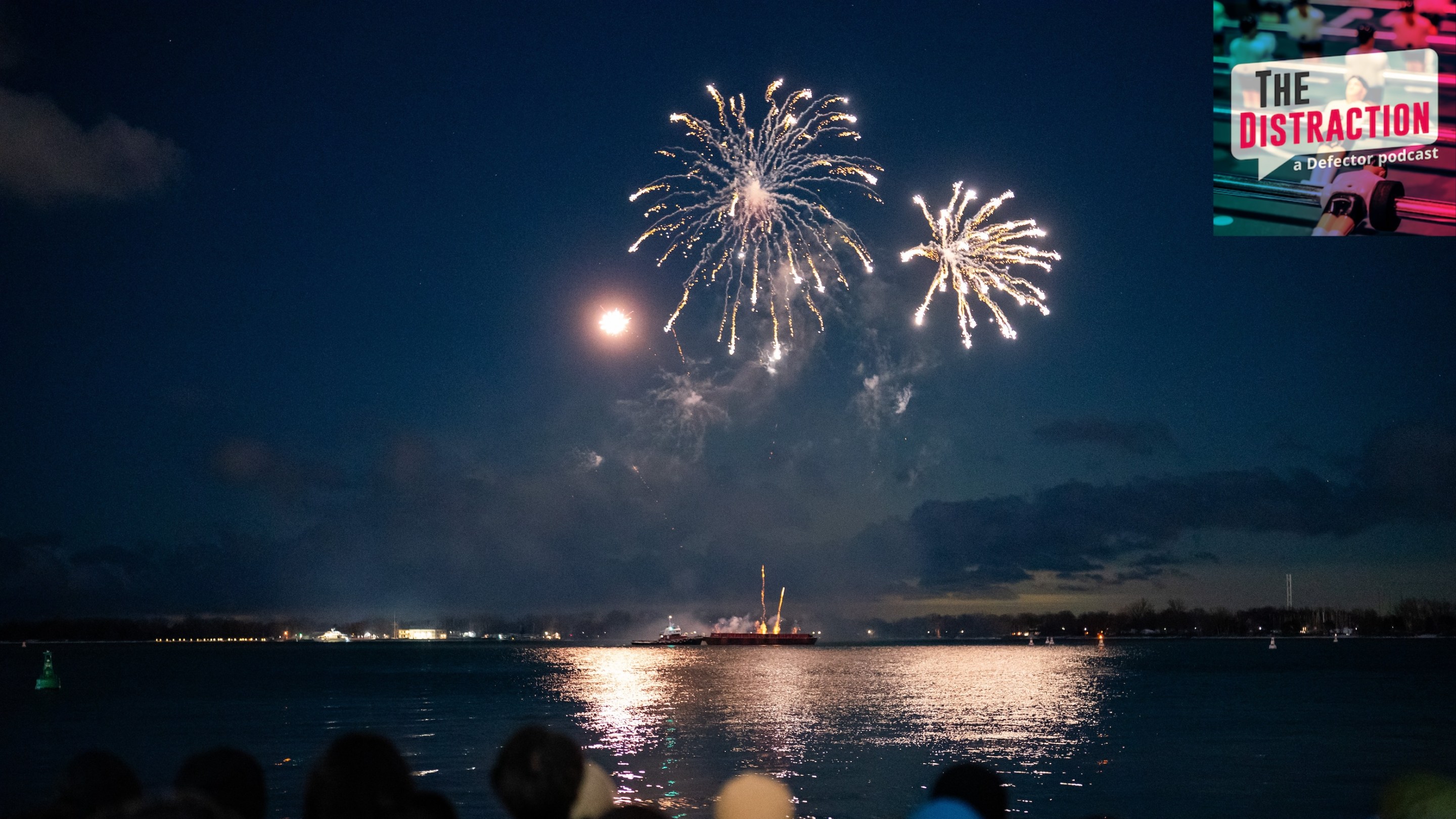 People take in a fireworks show on Lake Ontario at midnight from HTO Park in Toronto on January 1 2026.