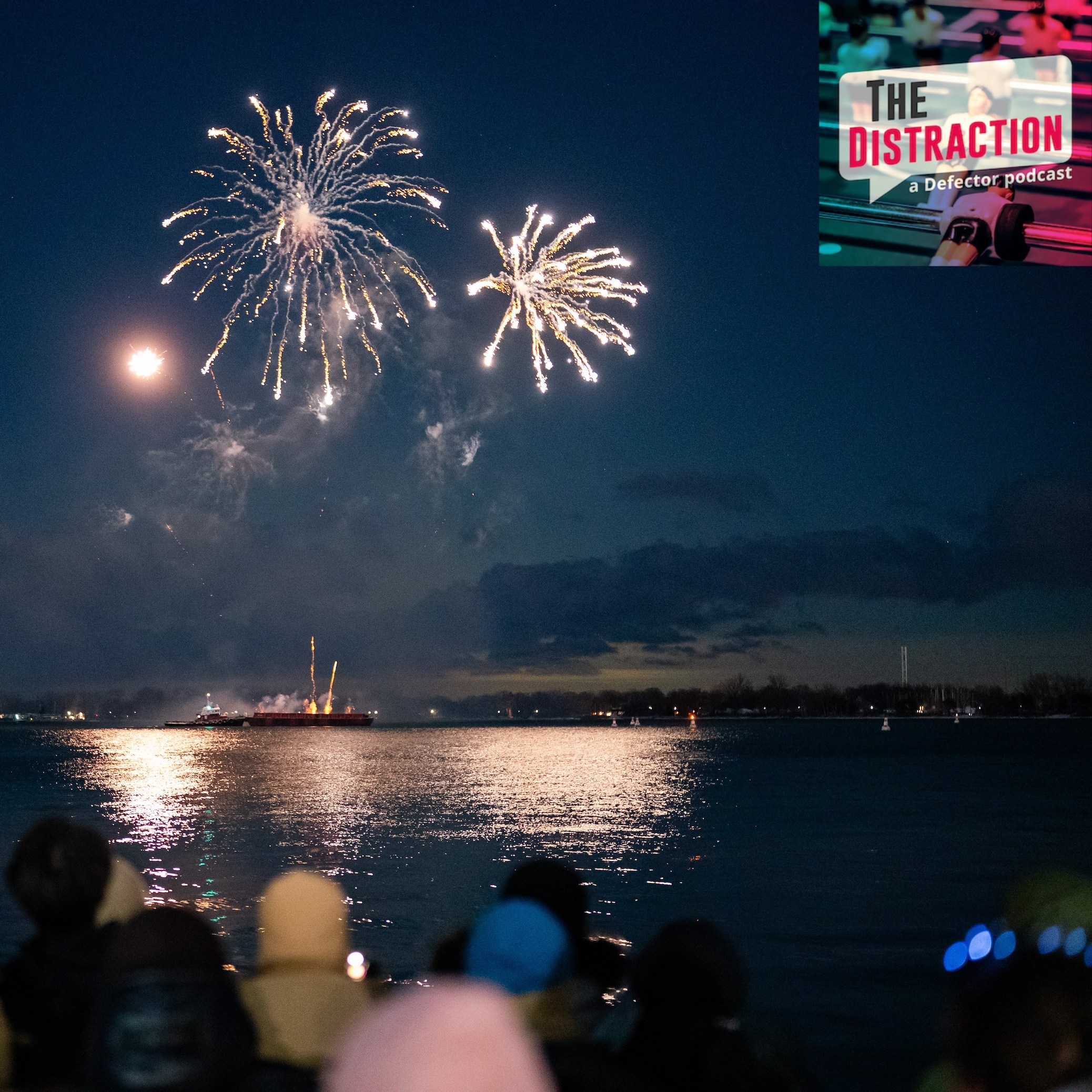 People take in a fireworks show on Lake Ontario at midnight from HTO Park in Toronto on January 1 2026.