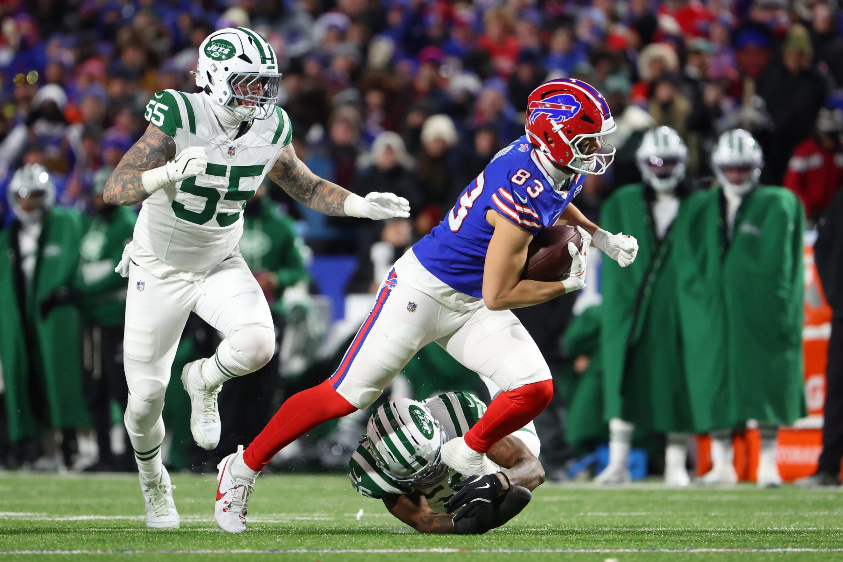 Keleki Latu #83 of the Buffalo Bills runs after the catch in the third quarter of Sunday's game against the Jets.