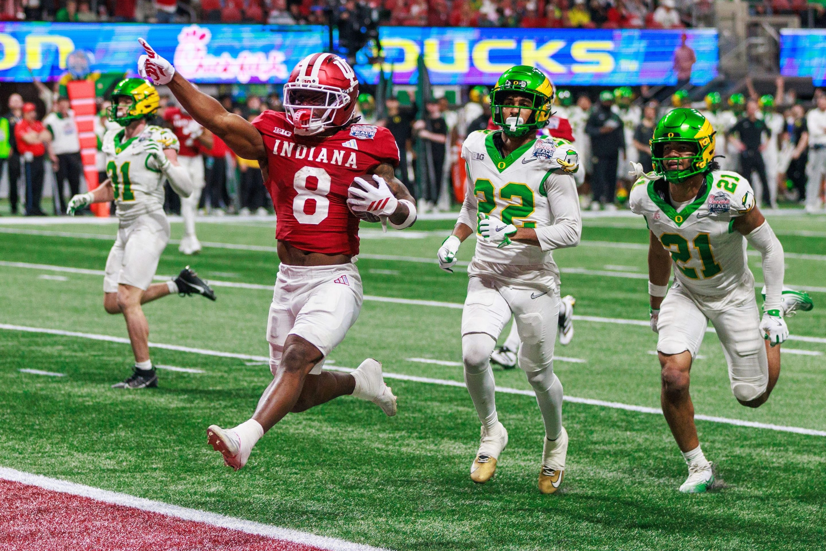 Indiana Hoosiers running back Kaelon Black (8) runs a touchdown against Oregon during the Chick-fil-A Peach Bowl.