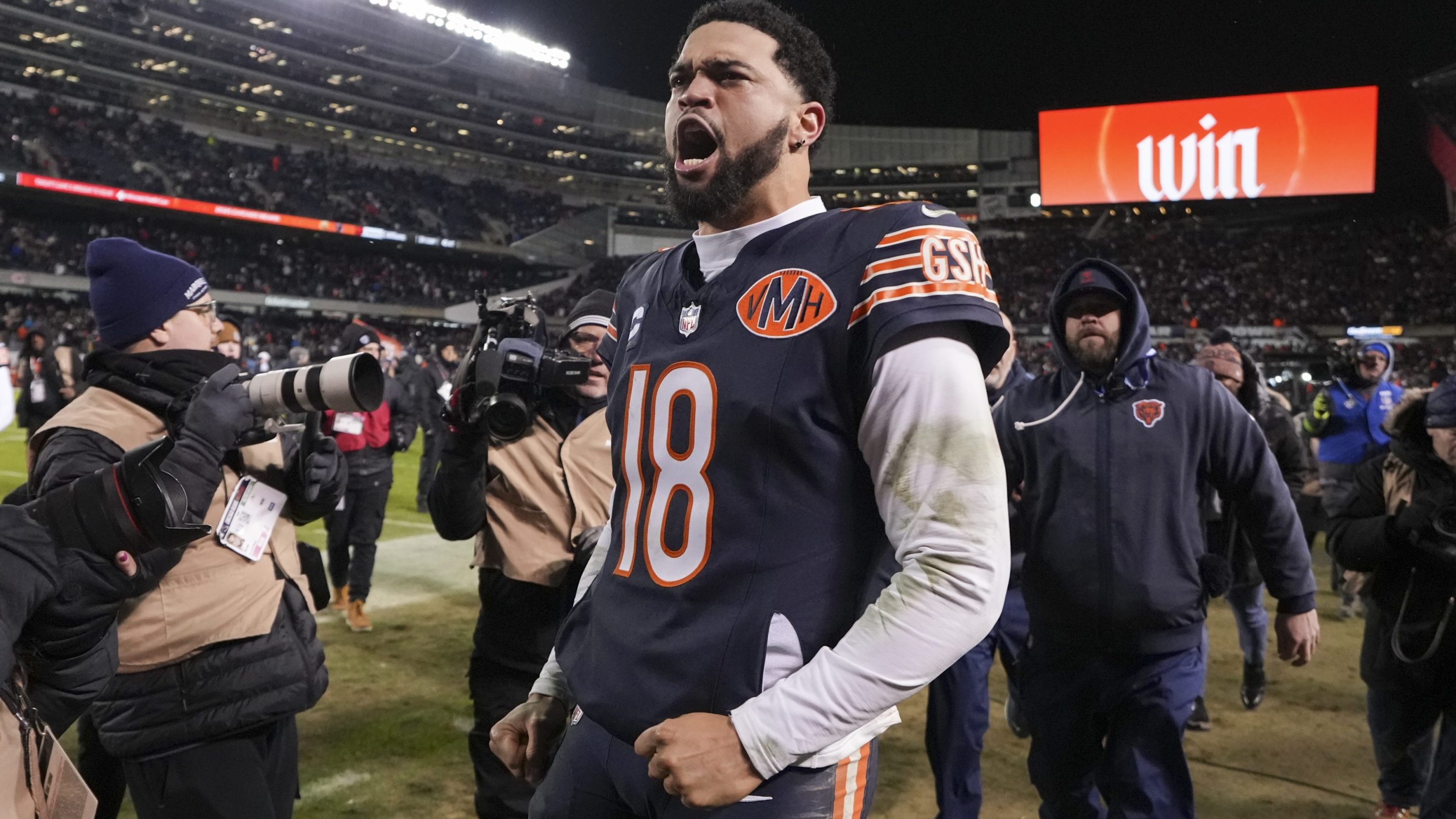 Caleb Williams #18 of the Chicago Bears celebrates after an NFL Wild Card game against the Green Bay Packers