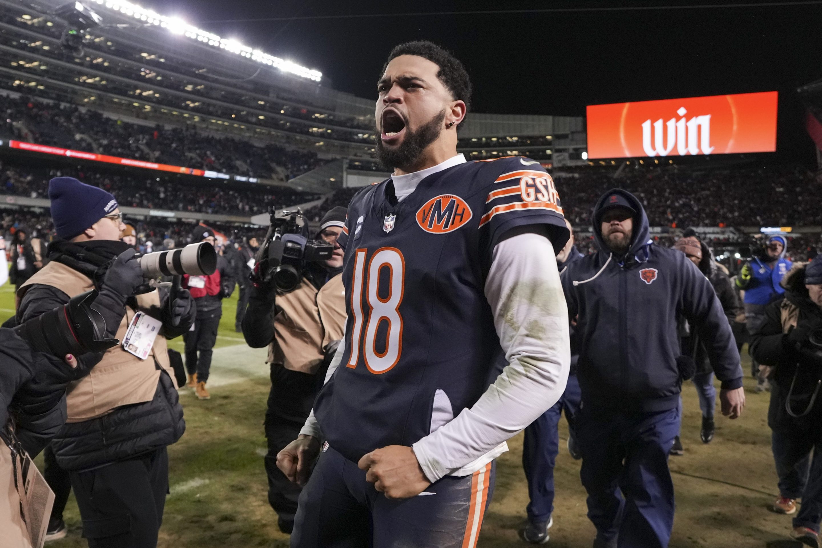 Caleb Williams #18 of the Chicago Bears celebrates after an NFL Wild Card game against the Green Bay Packers