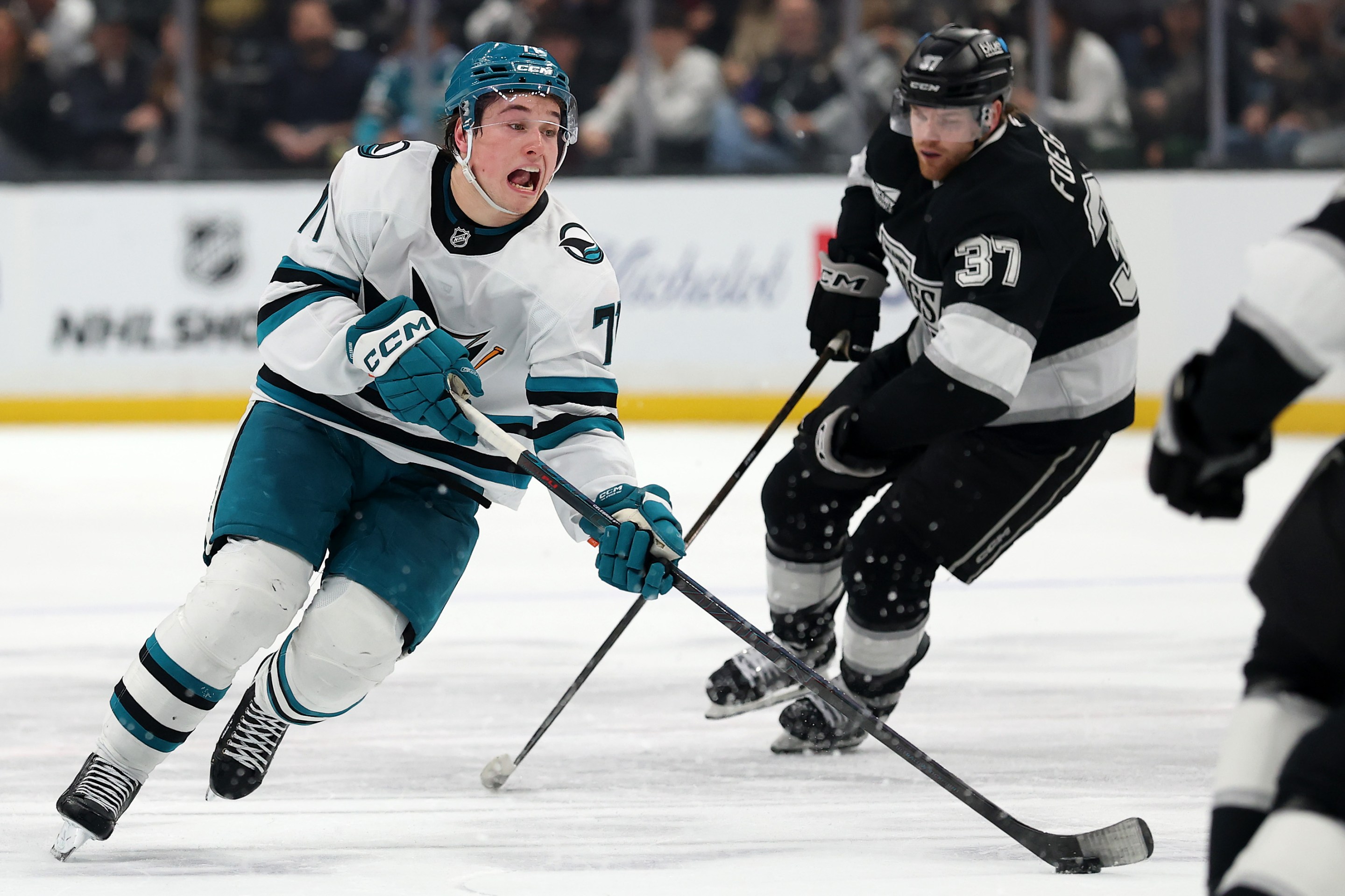 Macklin Celebrini #71 of the San Jose Sharks skates with the puck against the Los Angeles Kings during the third period at Crypto.com Arena on January 07, 2026 in Los Angeles, California