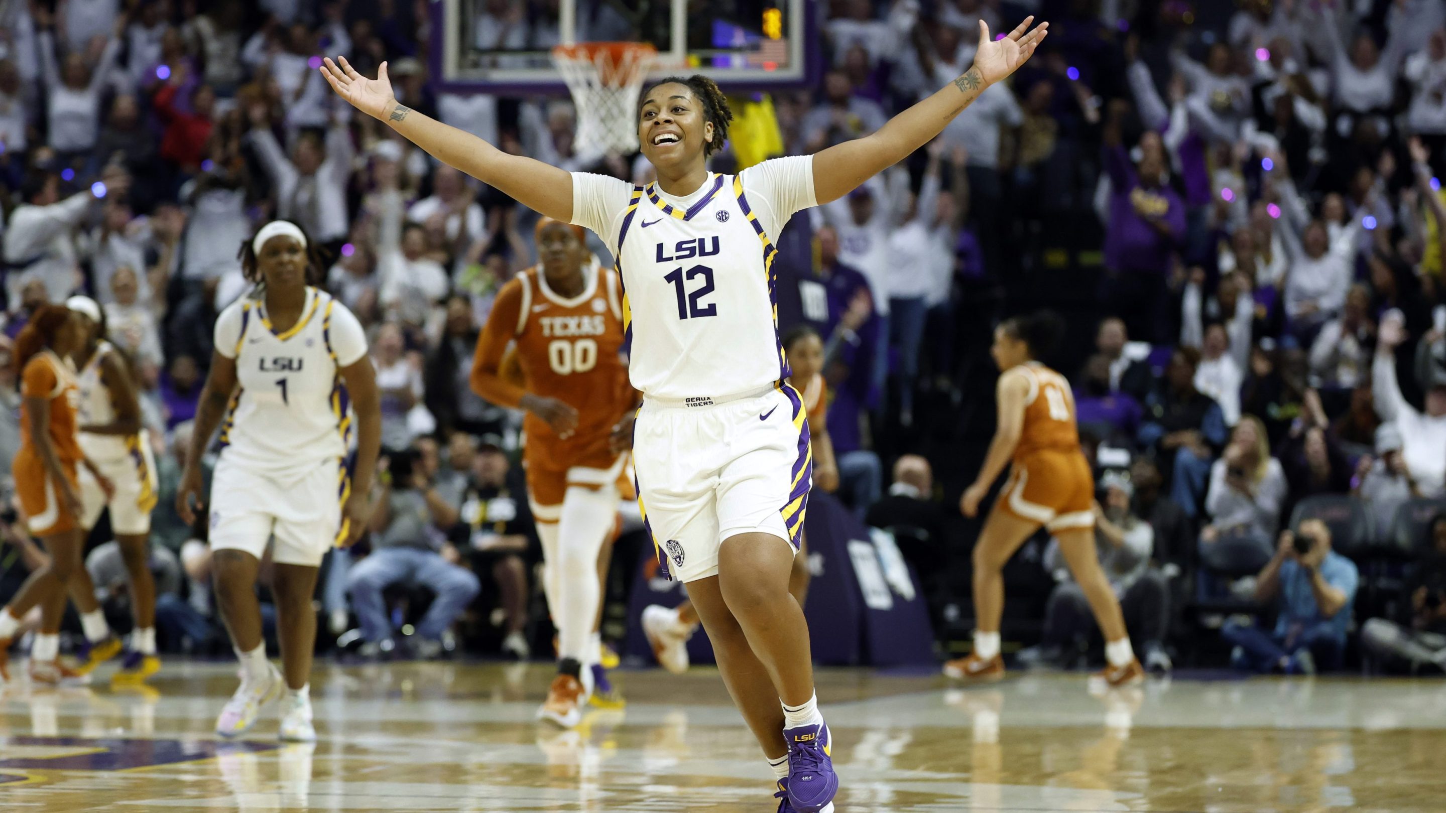 Mikaylah Williams #12 of the LSU Tigers celebrates after making a basket during the second half of a game against the Texas Longhorns at Pete Maravich Assembly Center on January 11, 2026 in Baton Rouge, Louisiana