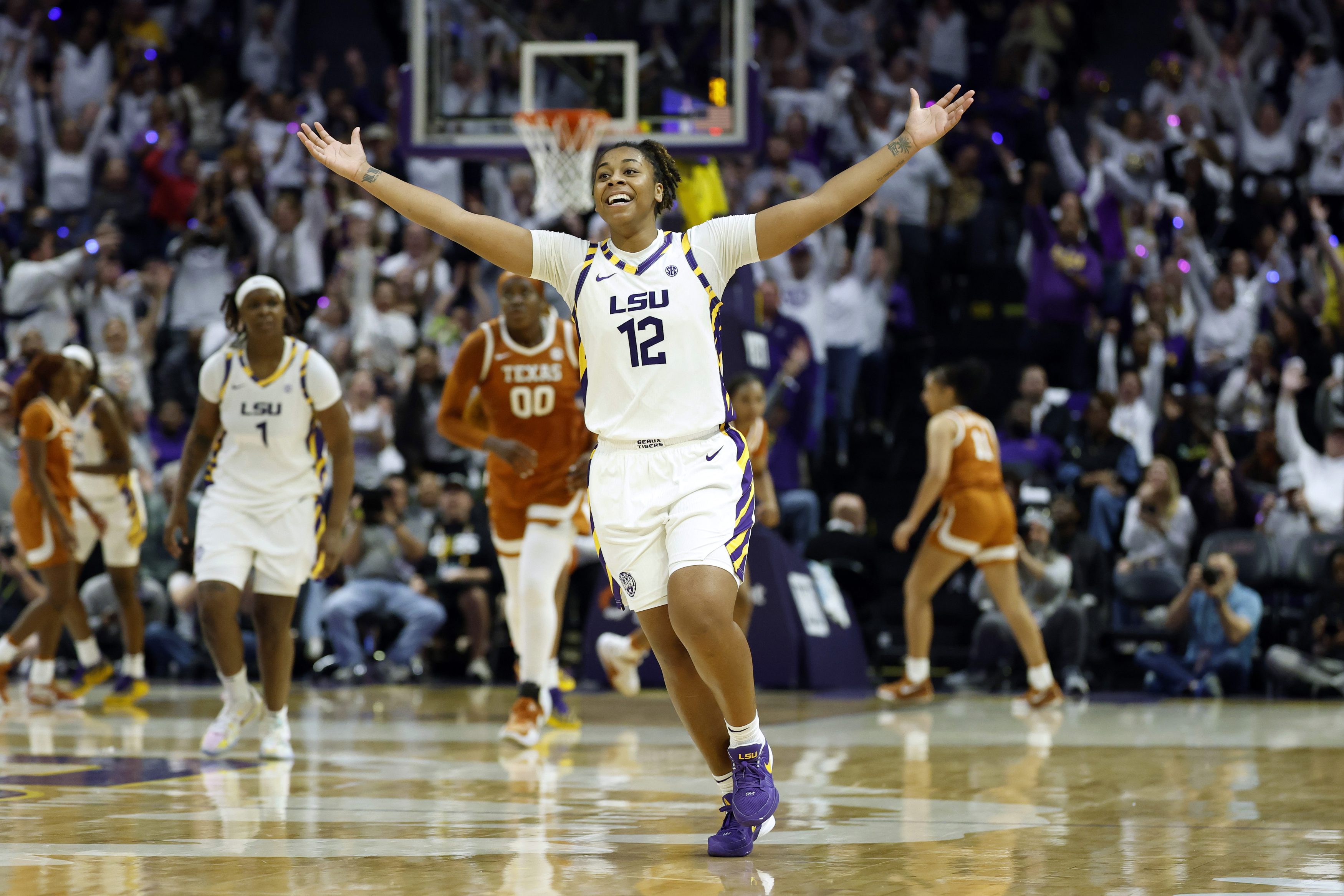 Mikaylah Williams #12 of the LSU Tigers celebrates after making a basket during the second half of a game against the Texas Longhorns at Pete Maravich Assembly Center on January 11, 2026 in Baton Rouge, Louisiana