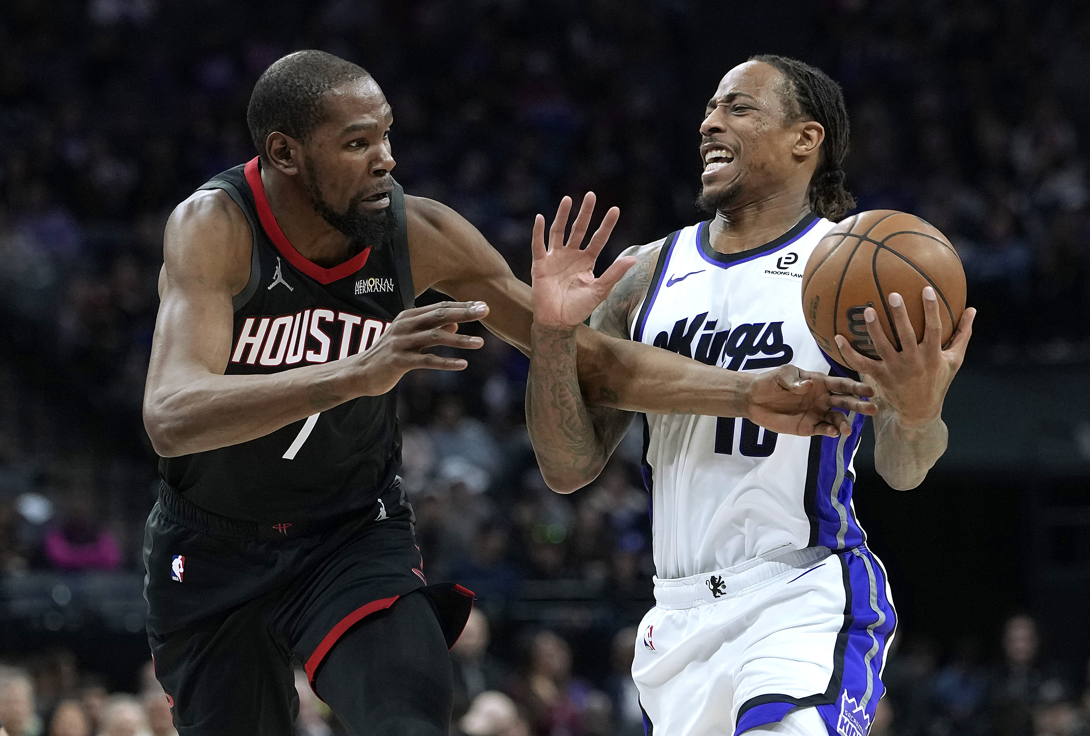 SACRAMENTO, CALIFORNIA - JANUARY 11: DeMar DeRozan #10 of the Sacramento Kings is fouled while going up for a shot against Kevin Durant #7 of the Houston Rockets in the second half at Golden 1 Center on January 11, 2026 in Sacramento, California. NOTE TO USER: User expressly acknowledges and agrees that, by downloading and or using this photograph, User is consenting to the terms and conditions of the Getty Images License Agreement. (Photo by Thearon W. Henderson/Getty Images)