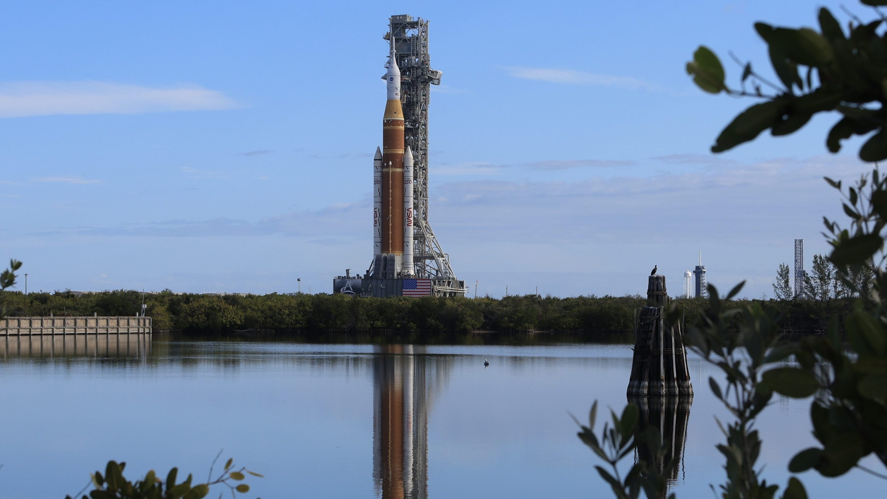 CAPE CANAVERAL, FLORIDA - JANUARY 17: NASA's Artemis II is rolled from the Vehicle Assembly Building to Launch Pad 39B at NASA’s Kennedy Space Center on January 17, 2026 in Cape Canaveral, Florida. NASA’s integrated SLS (Space Launch System) rocket and Orion spacecraft for the Artemis II mission are being rolled to Launch Pad 39B ahead of the 10-day mission in February 2026, which will take the crew around the Moon and back to Earth. (Photo by Joe Raedle/Getty Images)