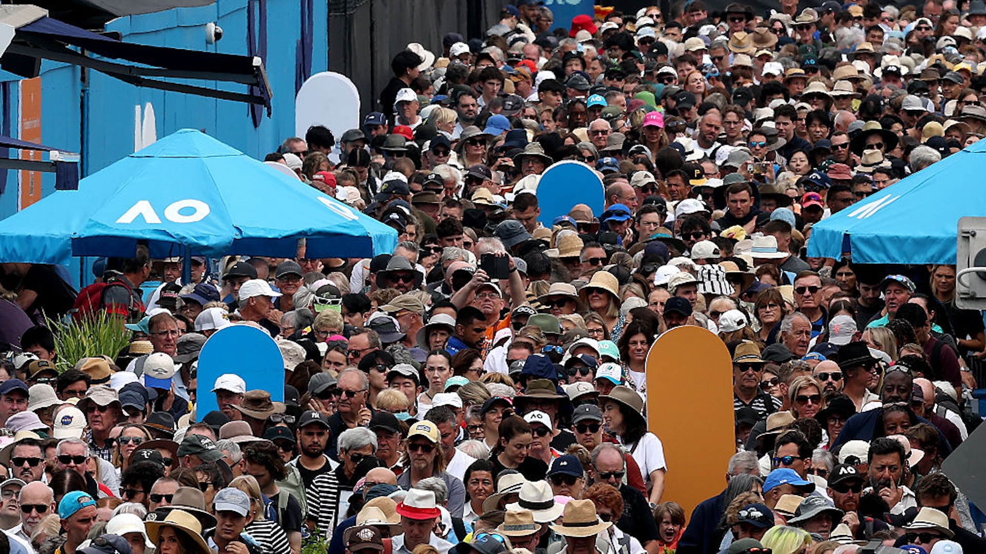 Fans line up to enter Melbourne Park ahead of day four matches at the Australian Open tennis tournament in Melbourne on January 21, 2026.