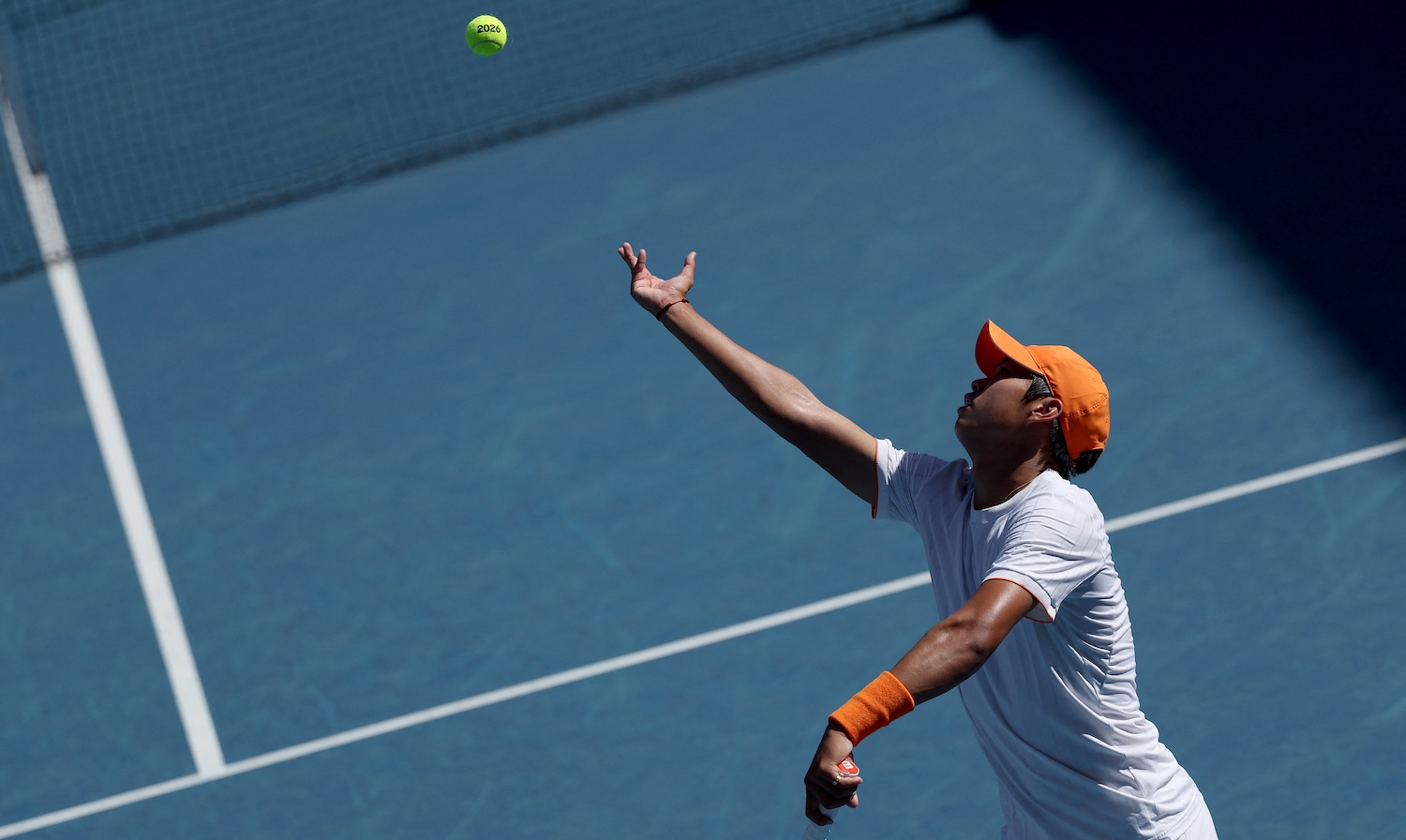 USA's Learner Tien serves to Kazakhstan's Alexander Shevchenko during their men's singles match on day four of the Australian Open tennis tournament in Melbourne on January 21, 2026. (Photo by Martin KEEP / AFP) / -- IMAGE RESTRICTED TO EDITORIAL USE - STRICTLY NO COMMERCIAL USE --