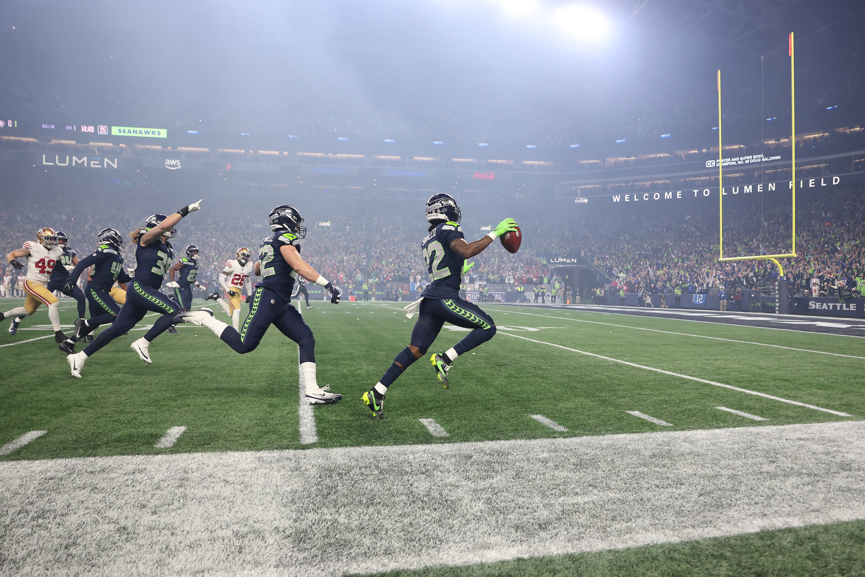 Rashid Shaheed #22 of the Seattle Seahawks returns the opening kickoff for a touchdown during the first quarter against the San Francisco 49ers in the NFC Divisional Playoff game at Lumen Field on January 17, 2026 in Seattle, Washington.