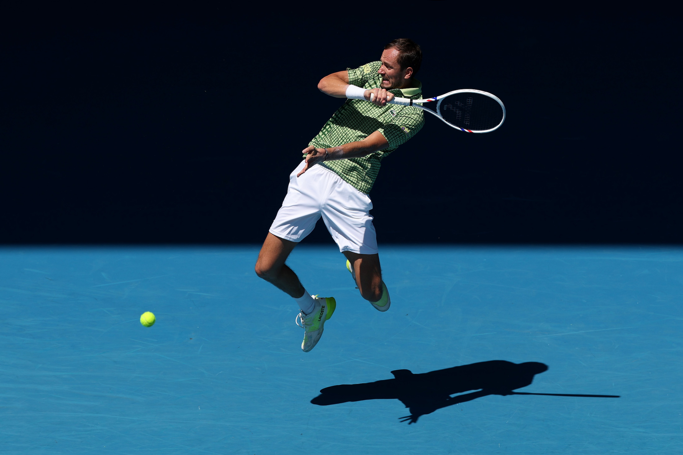 MELBOURNE, AUSTRALIA - JANUARY 19: Daniil Medvedev plays a forehand against Jesper de Jong of the Netherlands in the Men's Singles First Round during day two of the 2026 Australian Open at Melbourne Park on January 19, 2026 in Melbourne, Australia. (Photo by Cameron Spencer/Getty Images)