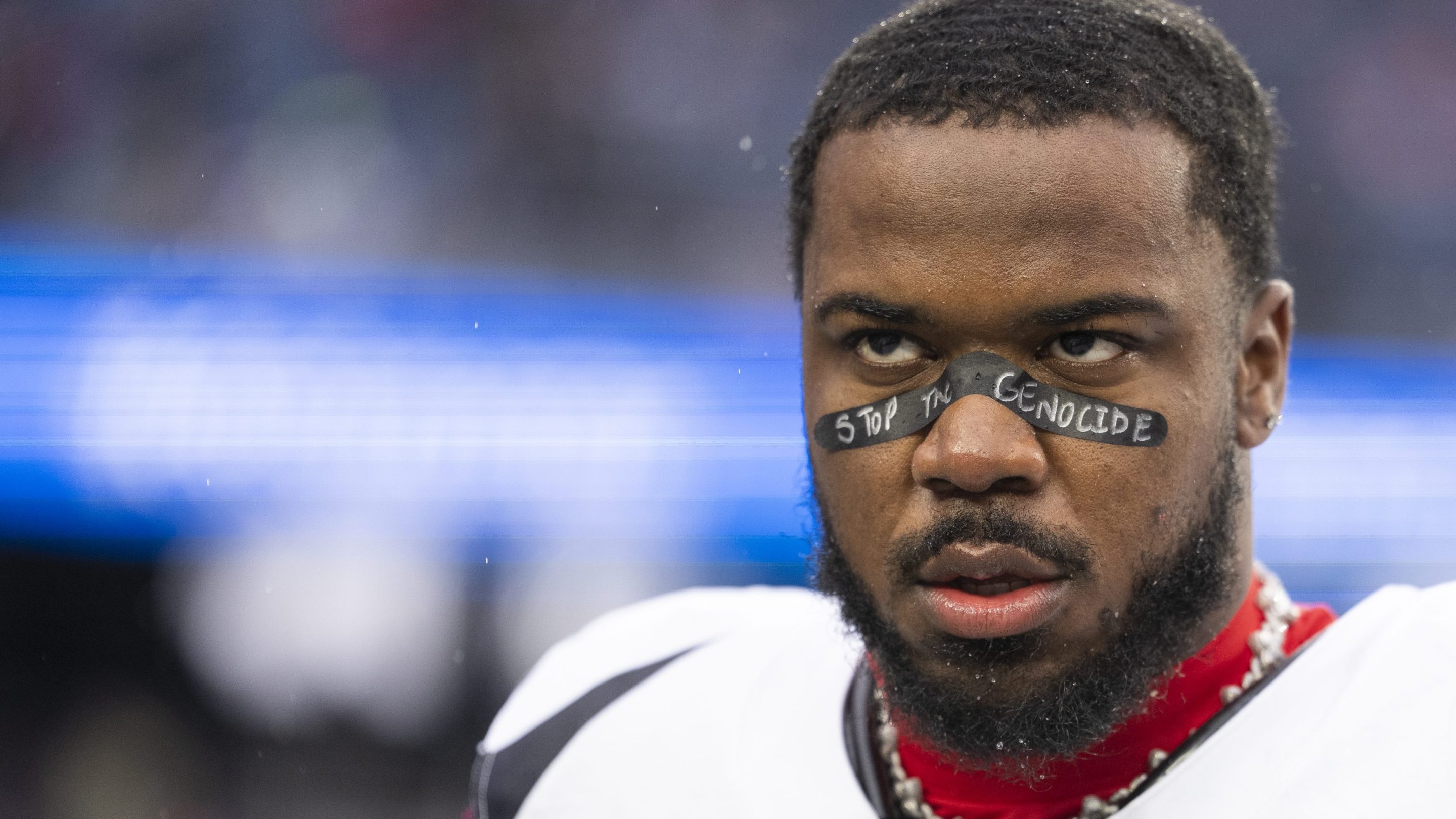 Azeez Al-Shaair wearing "Stop the Genocide" eye black before the Texans' game against the Patriots