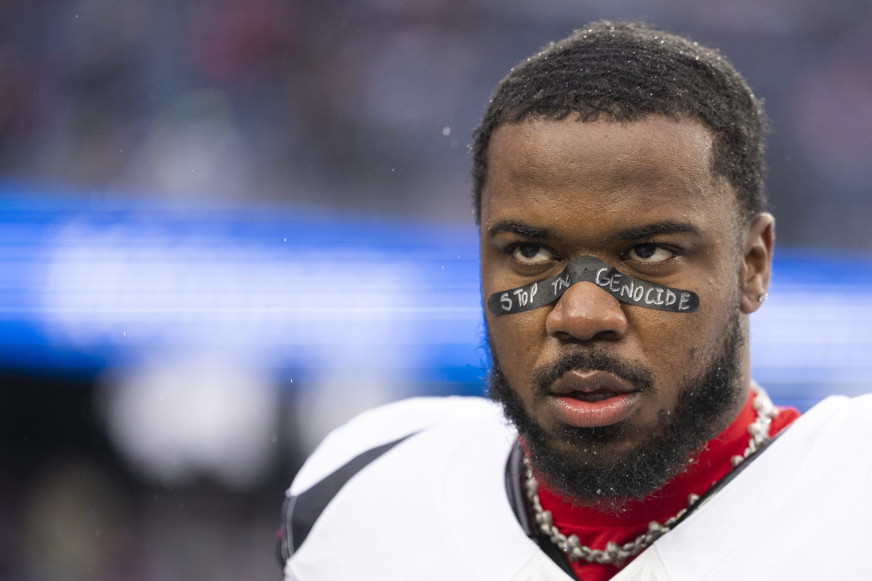 Azeez Al-Shaair wearing "Stop the Genocide" eye black before the Texans' game against the Patriots