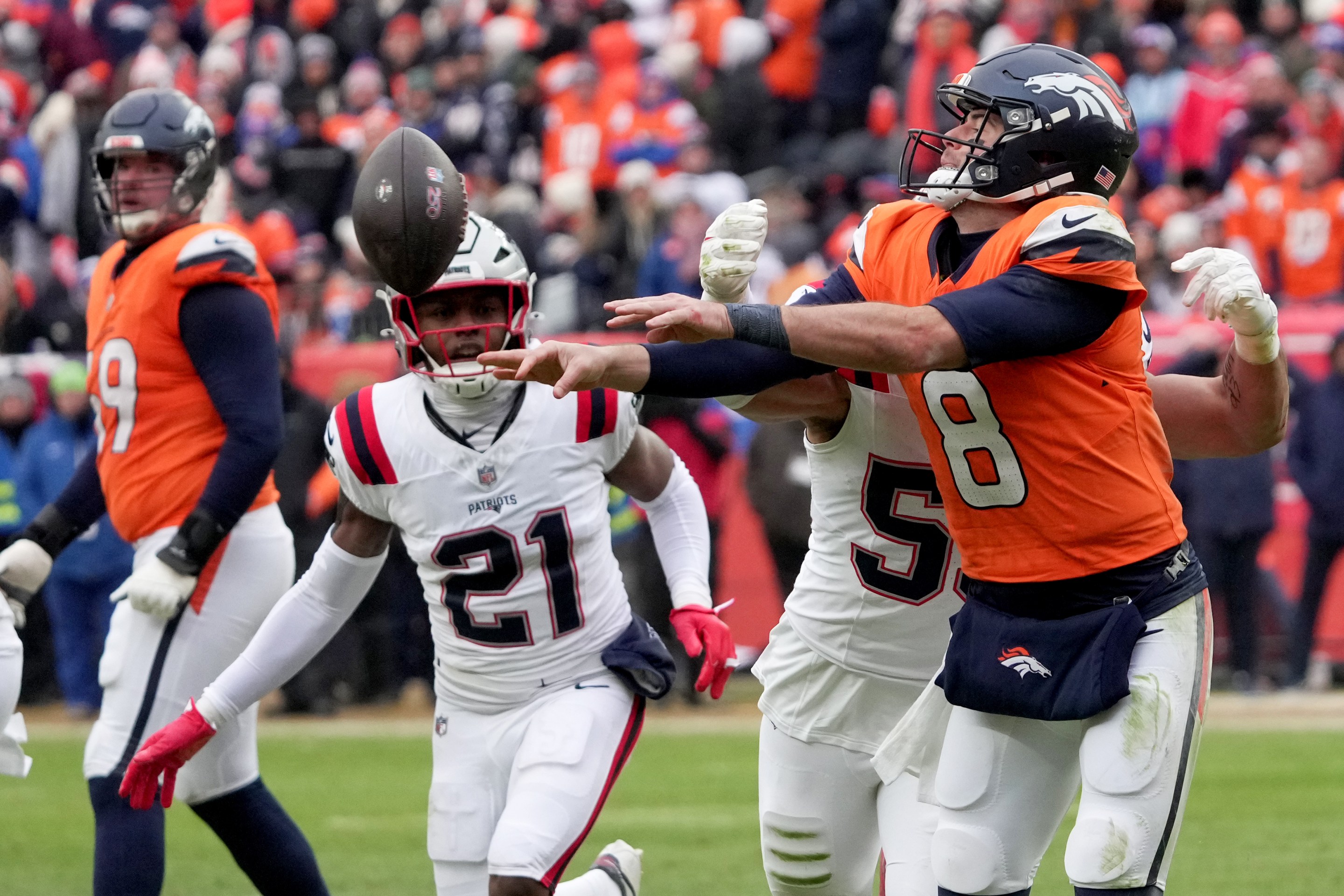 Denver, CO - January 25: Denver Broncos quarterback Jarrett Stidham throws a backward pass in the second quarter. The New England Patriots played the Denver Broncos in the AFC Championship Game at Empower Field at Mile High on January 25, 2026.