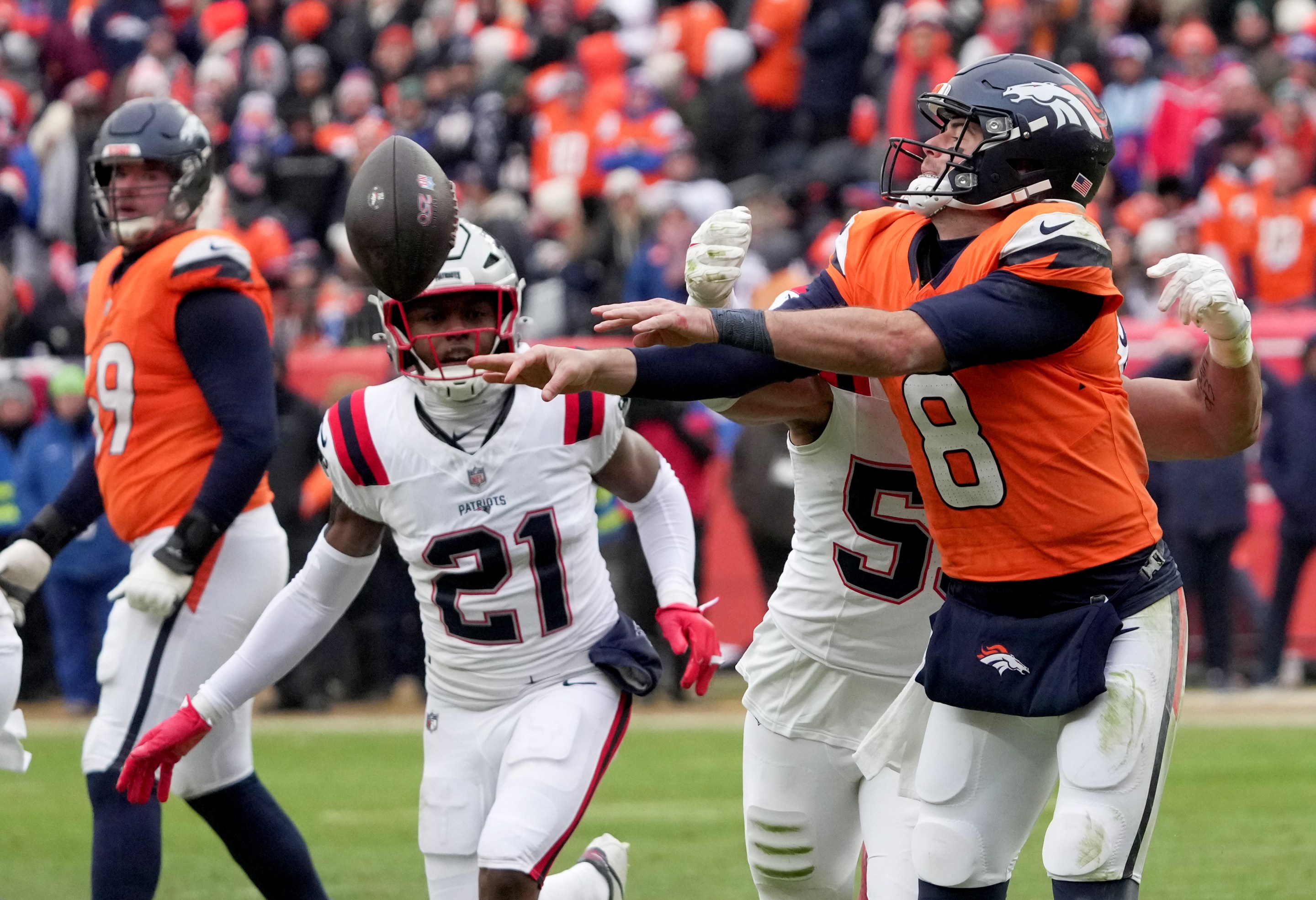 Denver, CO - January 25: Denver Broncos quarterback Jarrett Stidham throws a backward pass in the second quarter. The New England Patriots played the Denver Broncos in the AFC Championship Game at Empower Field at Mile High on January 25, 2026.