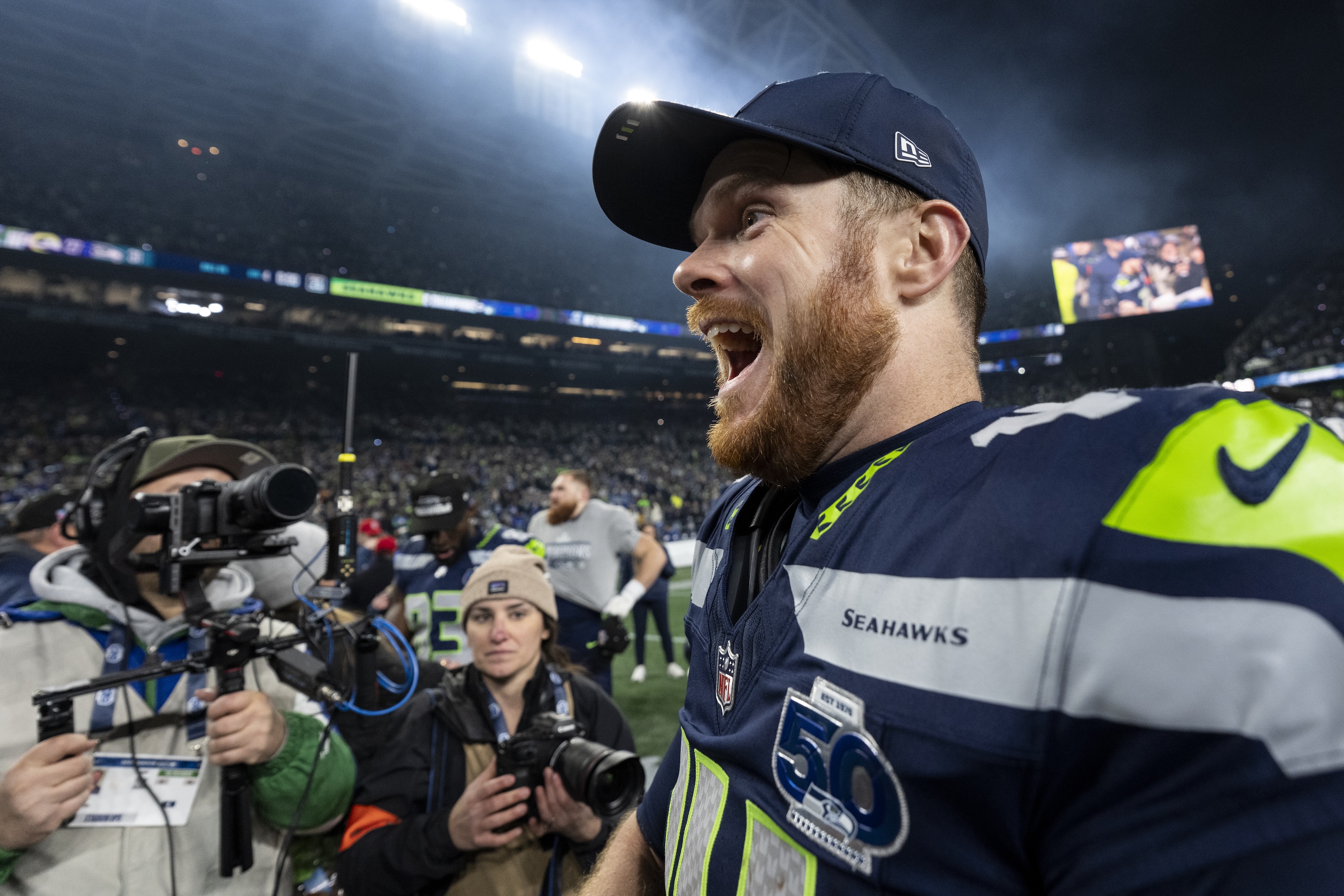 Sam Darnold of the Seattle Seahawks whoots enthusiastically following an NFC Championship NFL football game against the Los Angeles Rams at Lumen Field on January 25, 2026 in Seattle, Washington.