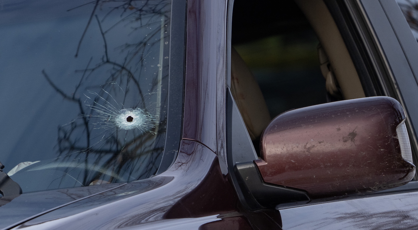 A single bullet hole can be seen on the driver’s side of the windshield of a vehicle that a woman was shot and killed in by federal officers on Portland Ave. in Minneapolis, Minn. on Wednesday, Jan. 7, 2026.