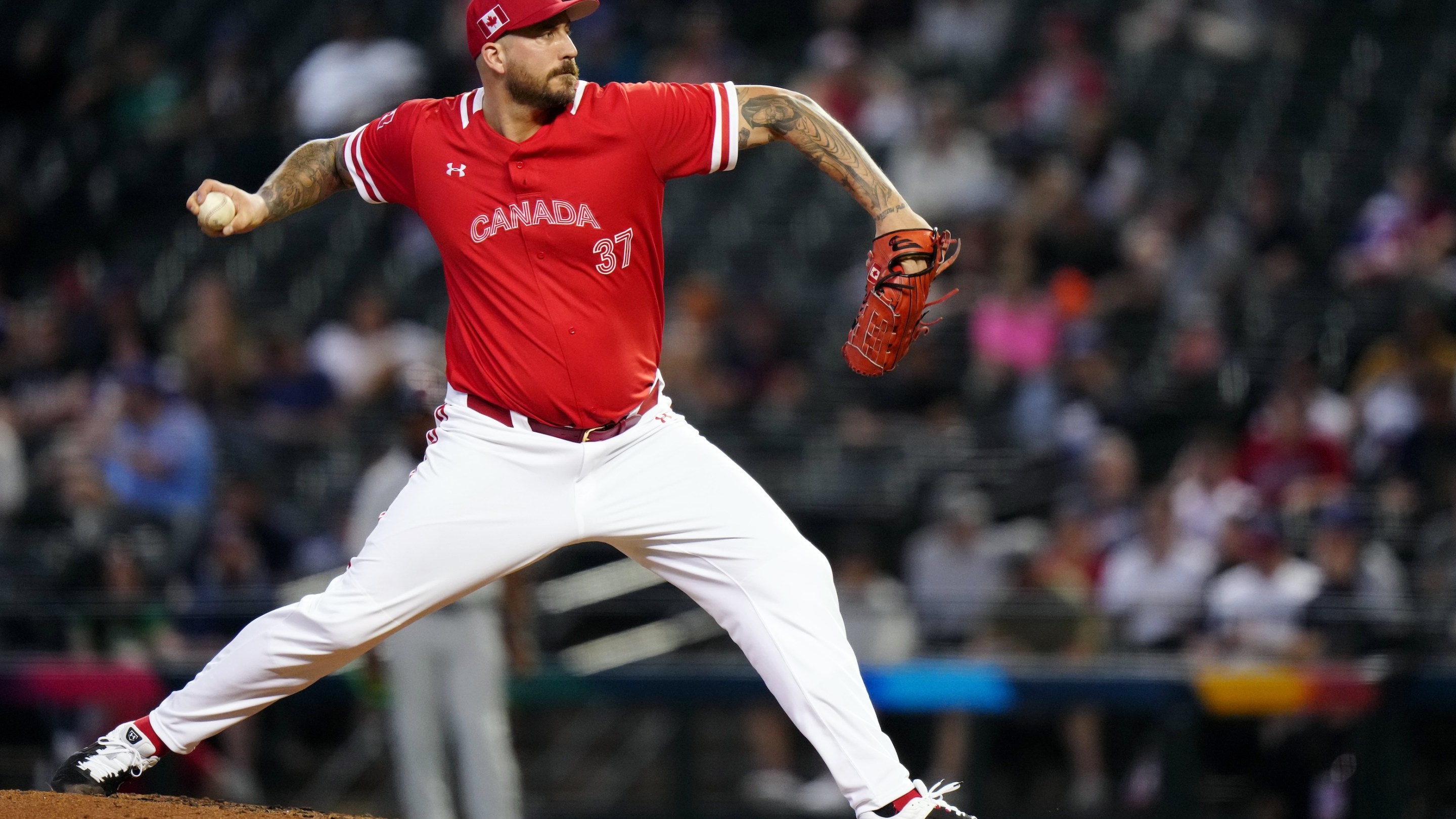 Phillippe Aumont of Team Canada pitches during Game 3 of Pool C between Team Great Britain and Team Canada at Chase Field on Sunday, March 12, 2023 in Phoenix, Arizona.