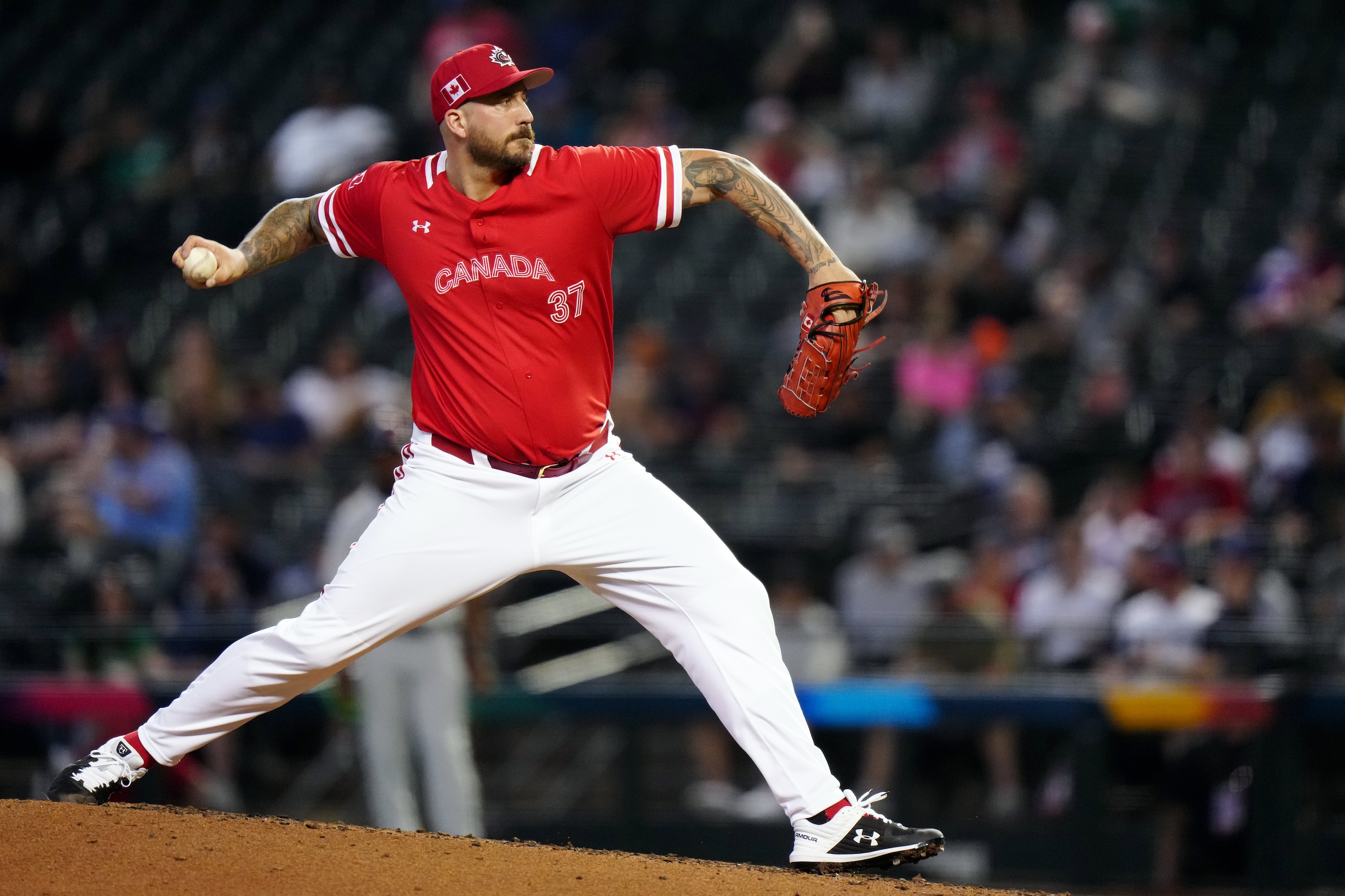 Phillippe Aumont of Team Canada pitches during Game 3 of Pool C between Team Great Britain and Team Canada at Chase Field on Sunday, March 12, 2023 in Phoenix, Arizona.