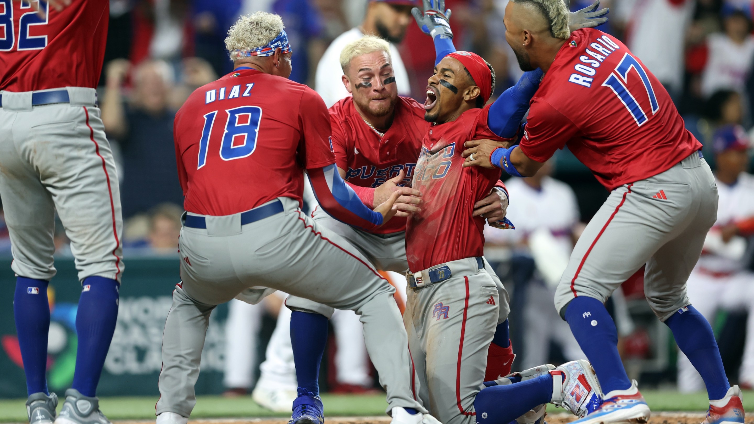 Francisco Lindor #12 of Team Puerto Rico celebrates with teammates after scoring in the fifth inning of Game 10 of Pool D between Team Puerto Rico and Team Dominican Republic at loanDepot Park on Wednesday, March 15, 2023 in Miami, Florida.