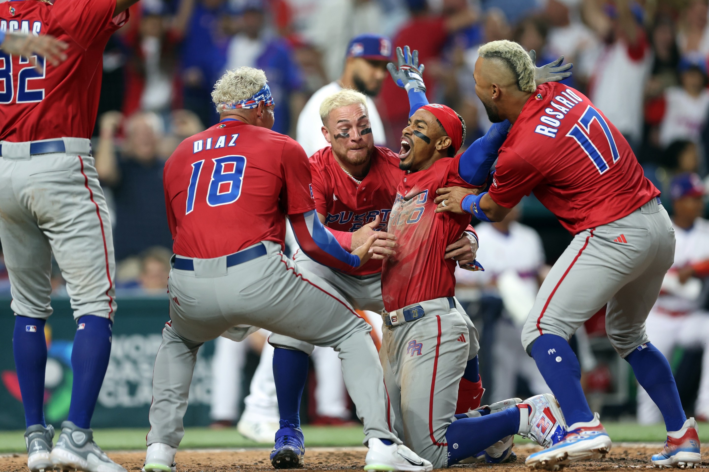 Francisco Lindor #12 of Team Puerto Rico celebrates with teammates after scoring in the fifth inning of Game 10 of Pool D between Team Puerto Rico and Team Dominican Republic at loanDepot Park on Wednesday, March 15, 2023 in Miami, Florida.