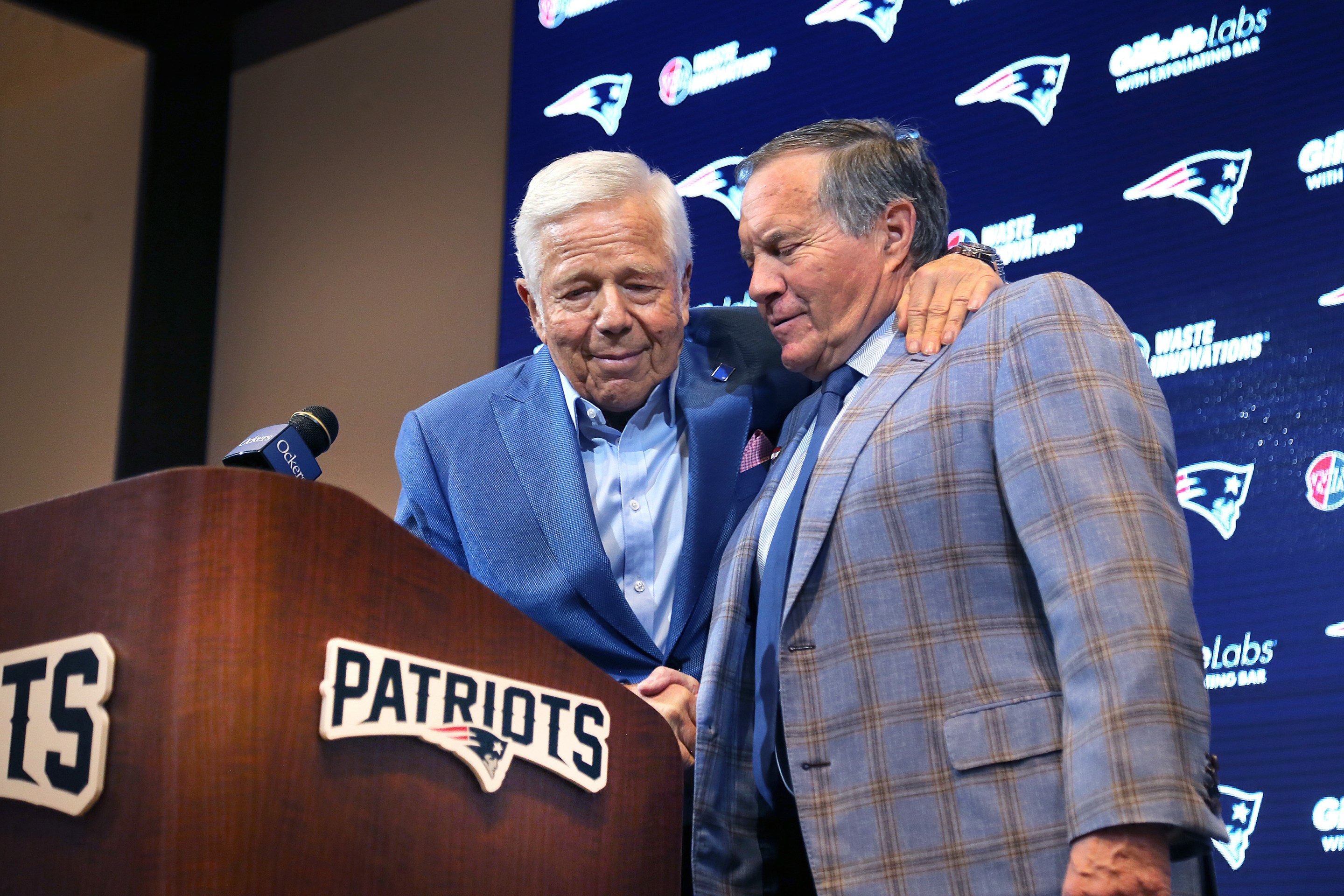 Robert Kraft puts his arm around former Patriots coach Bill Belichick at the end of a media availability on January 11, 2024.
