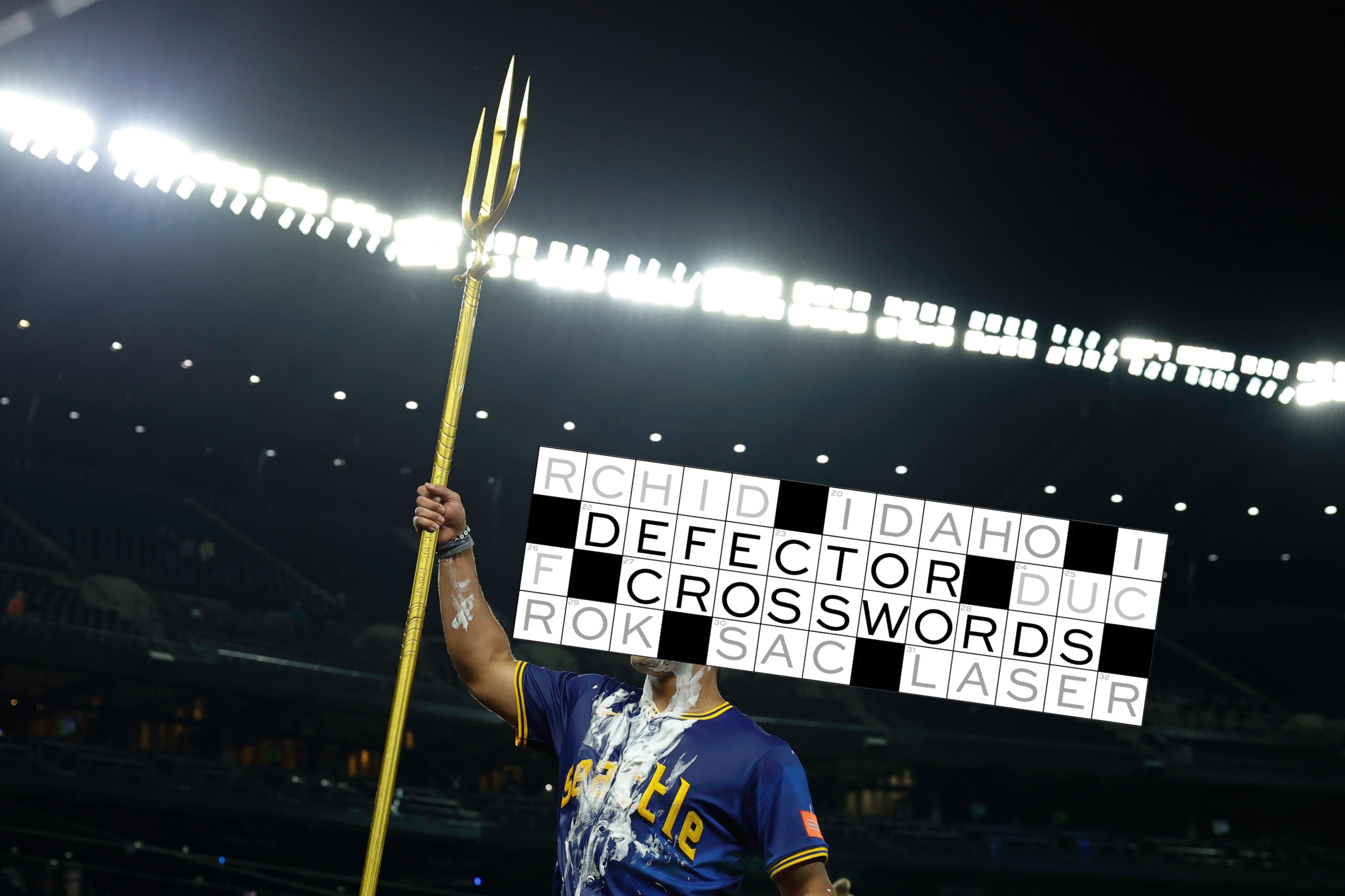 Harry Ford #5 of the Seattle Mariners raises the celebratory team trident after the game against the Los Angeles Angels at T-Mobile Park on September 11, 2025 in Seattle, Washington. The Seattle Mariners won 7-6 in 12 innings.