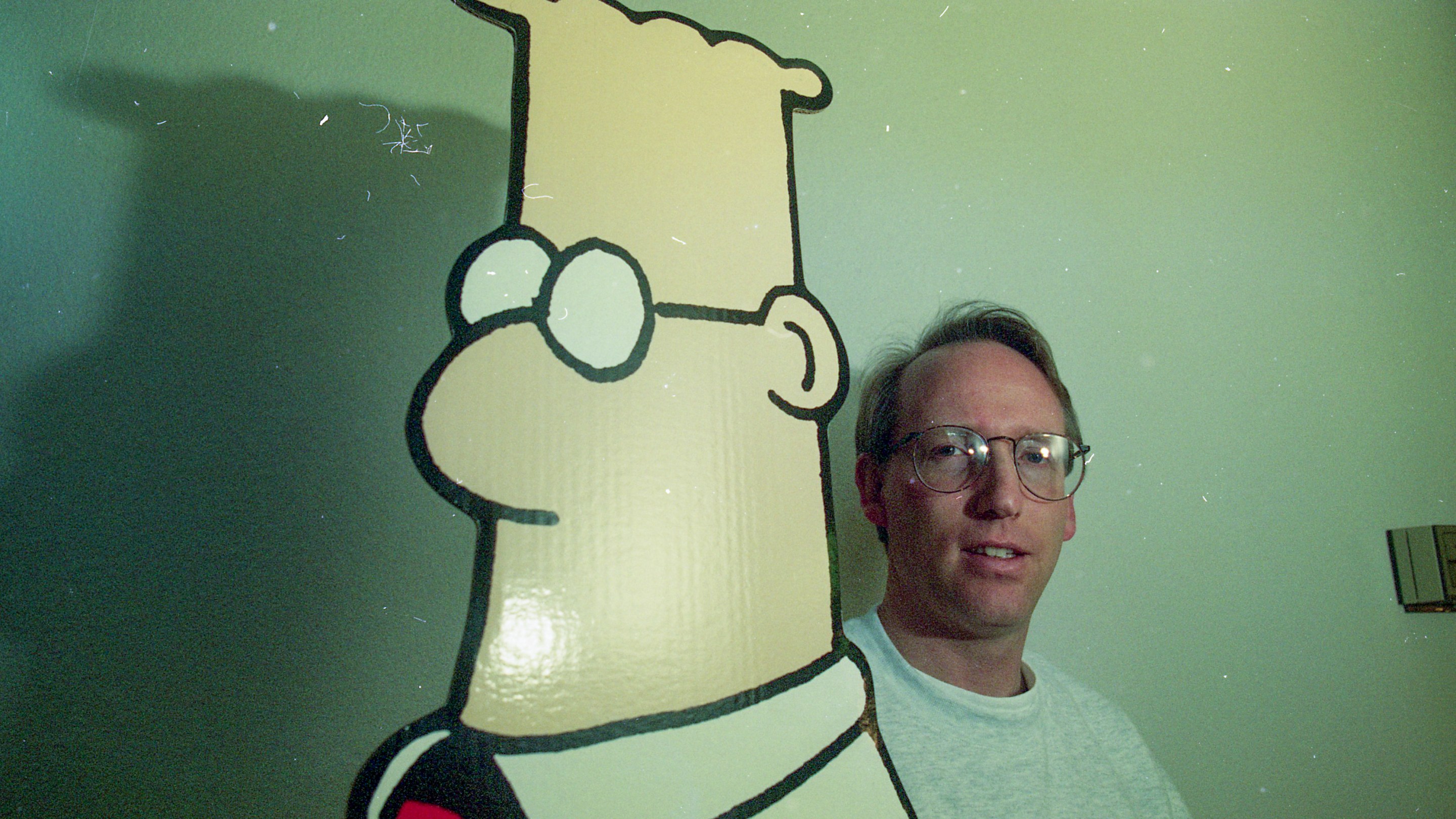 Artist Scott Adams, the creator the "Dilbert" comic series, poses with a cutout of his character in Dublin, Calif. on Feb. 7, 1996. (Photo by Michael Macor/San Francisco Chronicle via Getty Images)