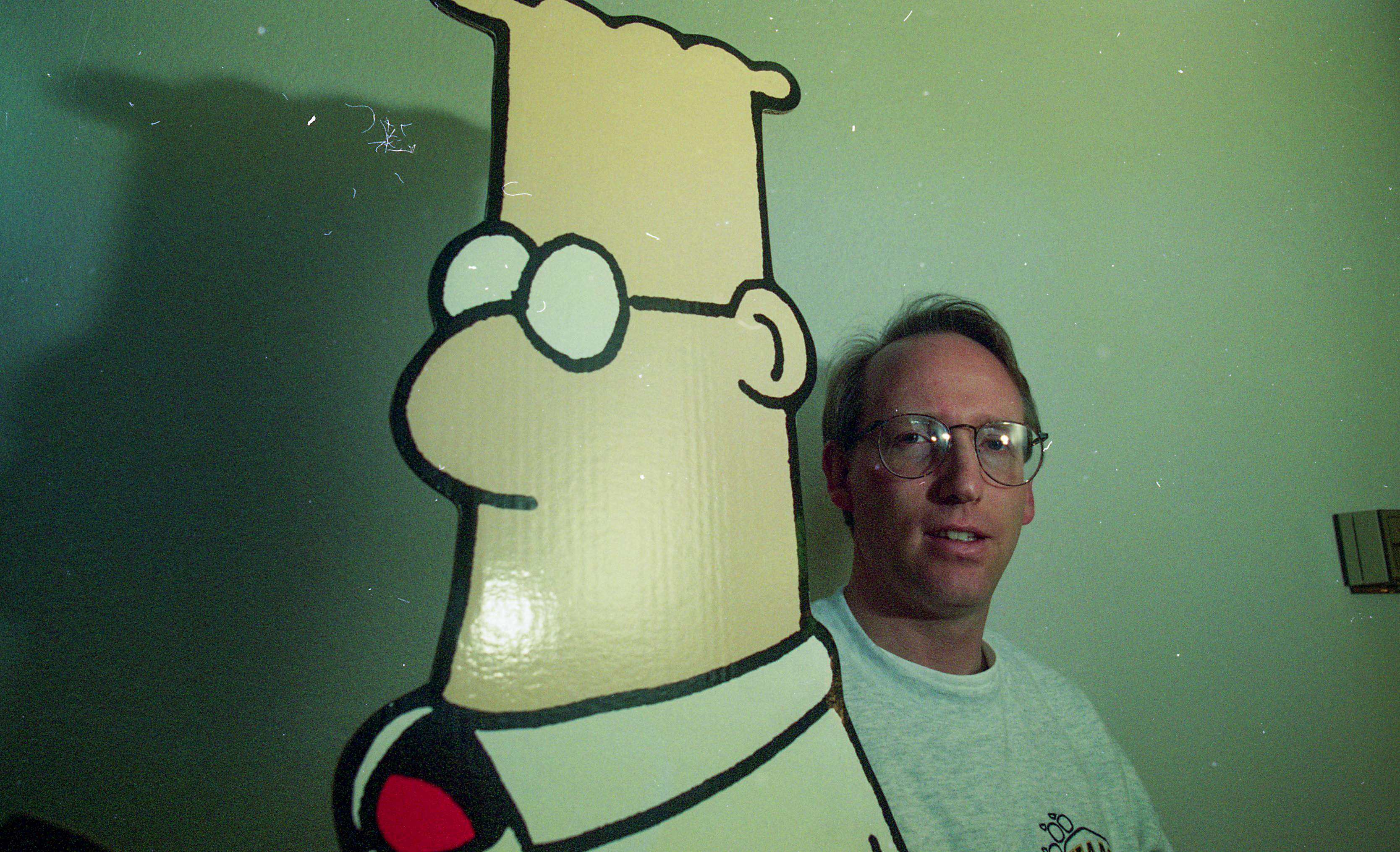 Artist Scott Adams, the creator the "Dilbert" comic series, poses with a cutout of his character in Dublin, Calif. on Feb. 7, 1996. (Photo by Michael Macor/San Francisco Chronicle via Getty Images)